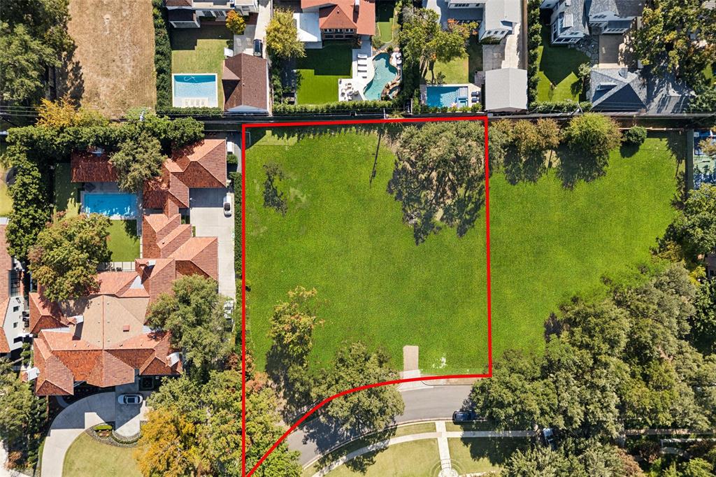 Situated on a rare 170-foot-wide lot, this is a truly exceptional and unique opportunity. Spanning 0.677 acres, this beautifully treed property—featuring several mature trees—has been graded and is ready for the construction of your dream home. Ideally located on one of Highland Park’s most desirable streets, it is within walking distance to Highland Park Village, Bradfield Elementary, as well as nearby parks, shops, and dining. The lot measures approximately 29,470 square feet (see new survey attached).
