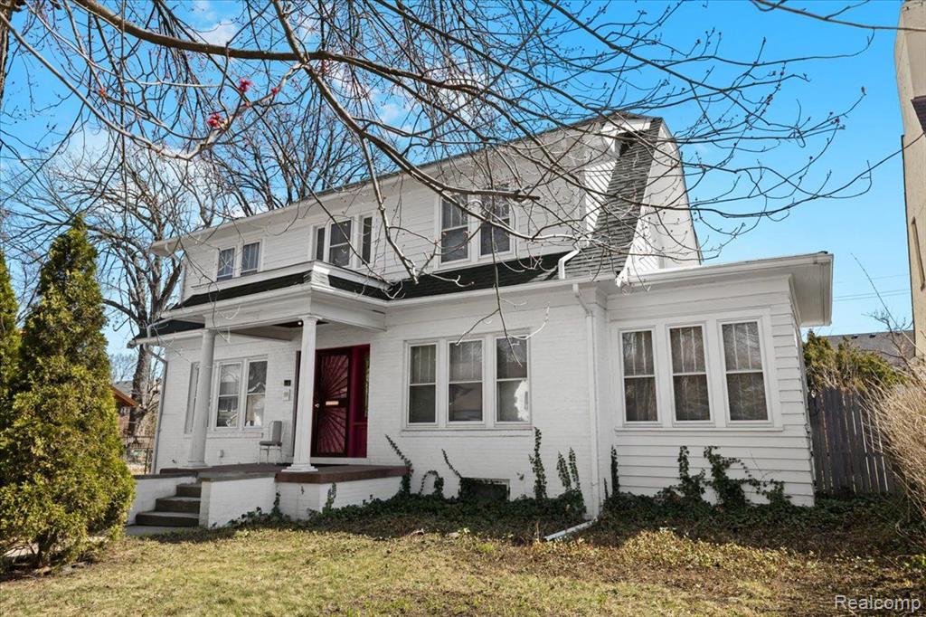 Don’t miss this opportunity to own a home in the Medbury Historic District of Highland Park! This elegant and spacious home beams with vintage charm from its crystal door knobs to the beautiful original hardwood flooring and plaster walls throughout both levels. A massive living room is highlighted by crown moulding, and a large fireplace flanked by built-in bookcases with leaded glass doors.  A brightly lit sitting room or home office is found off of the living room. French doors off the entryway open to the dining room which flows into the kitchen.  The charming kitchen overlooks the backyard and still has its original cabinets and antique sink. Half bath on the main floor is found in the back hallway. Upstairs, there are leaded glass windows in the hallway and four spacious bedrooms all that have a multitude of windows that flood the home with natural light. A large full bathroom has its original penny ceramic tile with updated fixtures. The attic is finished and has good flooring that offers plenty of storage space. Gas forced air furnace, central air conditioning and a new water heater. The basement has access directly to the backyard with its own staircase and doorway.  Enjoy a deck right off the kitchen in a fenced backyard and a one and half car garage with large storage area. The home is located West of Woodward Ave. on a quiet street with Meijer and Aldi grocery stores nearby. Just south of the Detroit Golf Club and Palmer Park, this is a gem of historic craftsmanship. Call for your private showing!