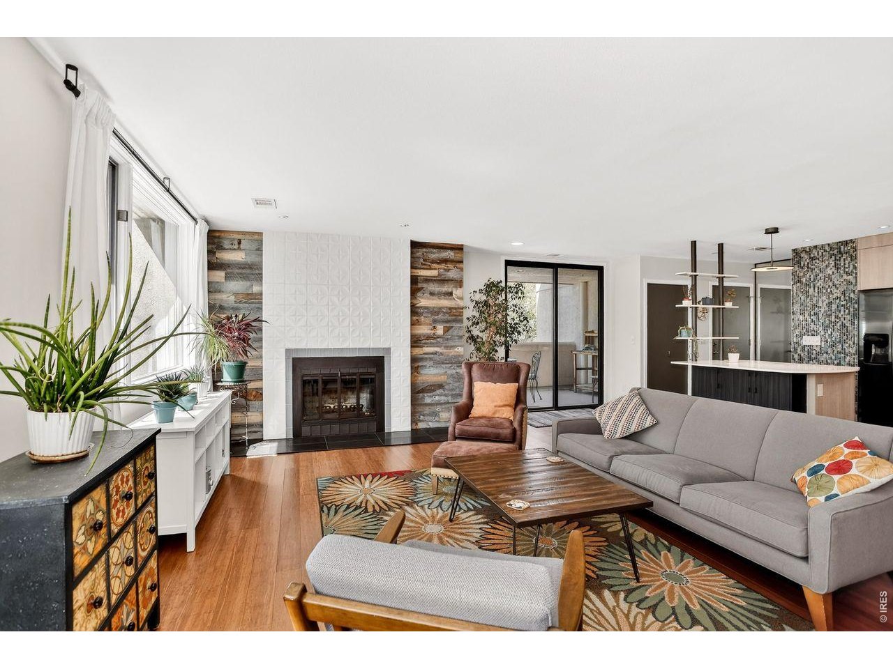 Newly priced. Splendidly remodeled and ideally situated on coveted Mapleton Hill, this refined end-unit condo blends modern luxury with timeless elegance. Bathed in natural light from windows on three sides, the residence offers a serene, gallery-like ambiance with expansive views and a sense of quiet privacy that is rare to find. Inside, the fully reimagined interiors showcase sophisticated, contemporary finishes and a thoughtful layout designed for both everyday living and effortless entertaining. The spacious primary suite serves as a true retreat; a custom walk-in closet elegantly delineates the sleeping space from the separate office or sitting area. Generous balconies extend the living space outdoors, inviting moments of relaxation with mountain views as a stunning backdrop. Beyond the residence itself, the secure building offers peace of mind along with a host of desirable amenities, including two dedicated, secured parking spaces, a storage locker, ample guest parking, a fitness center, and inviting shared spaces such as a reading or game room, a guest accommodations, and a secure bike area. A beautifully manicured, mature garden provides a tranquil outdoor escape-perfect for quiet reflection or gathering with friends.This exceptional home is further elevated by its premier location on Mapleton Hill, just moments from the vibrant heart of Downtown Boulder. Enjoy effortless walking access to beloved local destinations like the Pearl Street Mall, Ideal Market and the scenic trails of Mount Sanitas, where outdoor adventure meets everyday convenience. Offering a unique combination of refined design, premium amenities, and an unparalleled location, this residence is perfectly suited for discerning buyers seeking both sophistication and the quintessential Boulder lifestyle. Excellent lock-n-leave opportunity! Sundance Film Festival Rentals Approved by HOA board for 2027!!!
