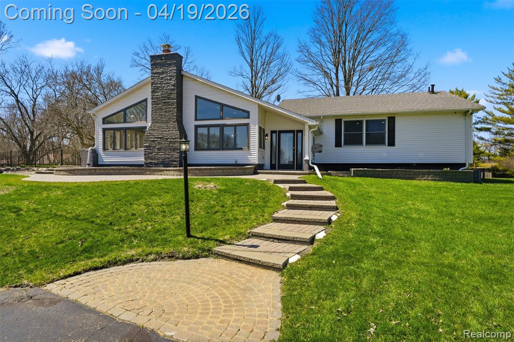 Set on 6.7 private acres with a gated entrance, this one-of-a-kind property offers an exceptional blend of space, privacy, and versatility. A standout feature is the fully finished 8-car garage with heat, A/C, painted interior, and its own bathroom, creating the perfect setup for car enthusiasts, hobbyists, or extra workspace. The property also includes a massive 2-story pole barn with a basement and 2 horse stalls, along with fenced areas ideal for horses, storage, or a variety of other uses. Inside, the home has been beautifully updated with brand-new bathrooms, lighting, paint, and water heater. The 3-bedroom, 2.5-bath layout features a spacious living room with a gas-log fireplace, a modern granite kitchen, and an in-law suite with its own bedroom and full kitchen, ideal for guests or extended family. With two generators servicing both the home and garage, this rare property offers comfort, function, and endless possibilities.