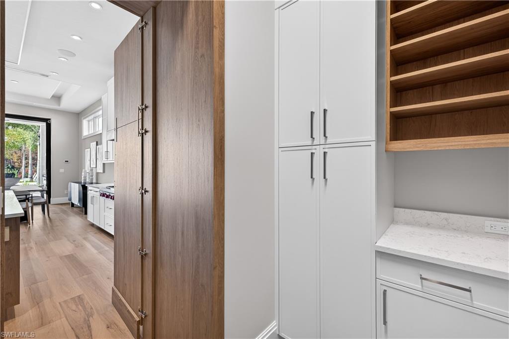 Detailed view of wood finished floors and recessed lighting