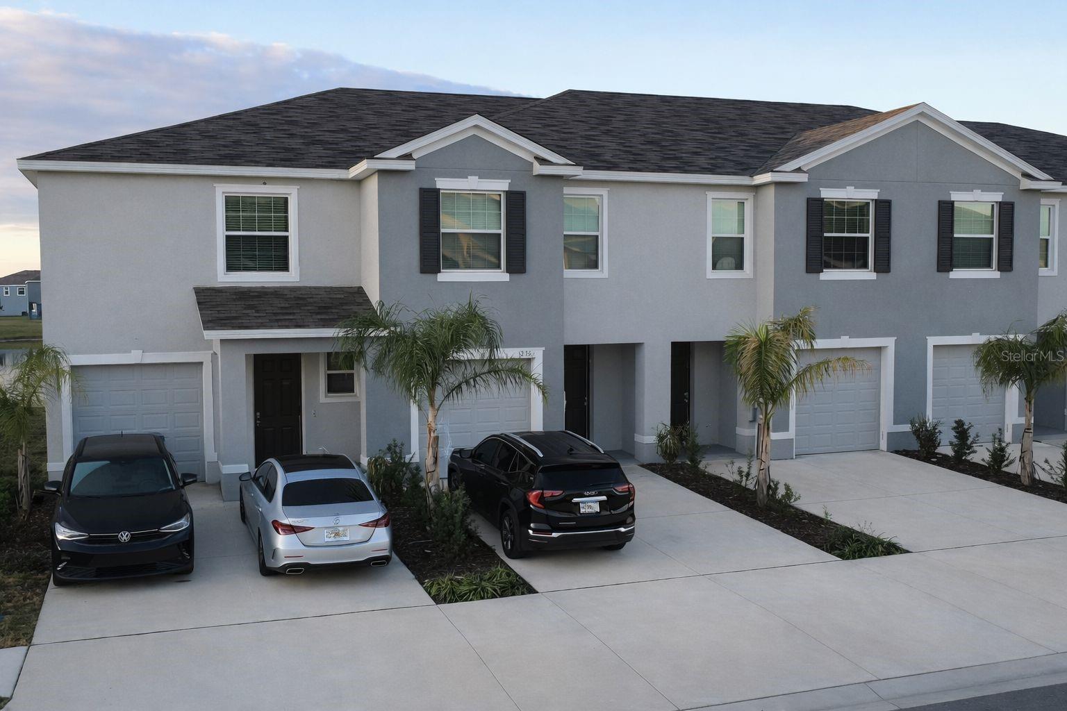 Welcome to Meadow Ridge at Epperson Lagoon in Wesley Chapel! This beautifully maintained 2023 townhome offers modern living with an open-concept layout designed for both comfort and entertaining, featuring a spacious kitchen with contemporary finishes, ample cabinetry, and seamless flow into the light-filled dining and living areas. Upstairs, generously sized bedrooms and well-appointed bathrooms provide privacy and functionality, creating a layout that truly feels like home. Beyond the impeccable interior, this property delivers exceptional resort-style living, where registered household residents enjoy complimentary year-round access to the breathtaking 8-acre crystal-clear lagoon, with entry included in the community fees, plus 25 guest passes annually to share the experience with friends and family, and additional guest entries available for just $5 each person thereafter. Residents also have access to the spectacular Mirada Lagoon, the largest in the area at approximately 15 acres, for only $5 each visit (guest passes do not extend to Mirada). Conveniently located near shopping, dining, major highways, and top-rated schools, this home offers not just style and convenience, but an elevated Florida lifestyle buyers can envision enjoying year-round. As a standout feature, the property backs directly onto the lake, offering stunning and permanent water views that provide tranquility, privacy, and the perfect backdrop for relaxing at the end of the day or entertaining guests while enjoying beautiful sunsets. The lake view adds value, exclusivity, and a refined atmosphere that truly sets this home apart within the community. Immediately upon entry, you are welcomed by the exclusive Jack Bar — a custom-built artisanal bar thoughtfully designed to centralize your beverages with both elegance and functionality. In addition to being ideal for entertaining, its modern design creates a striking focal point, adding personality, charm, and a distinctive touch that makes this residence truly unique and unforgettable.