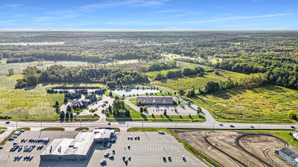 Large Parcel located in sprawling Commercial Area. 
Public Sewer & Water at the street. 
117 ft frontage on Gratiot with a depth of 636 ft that heads back to the parcel.
