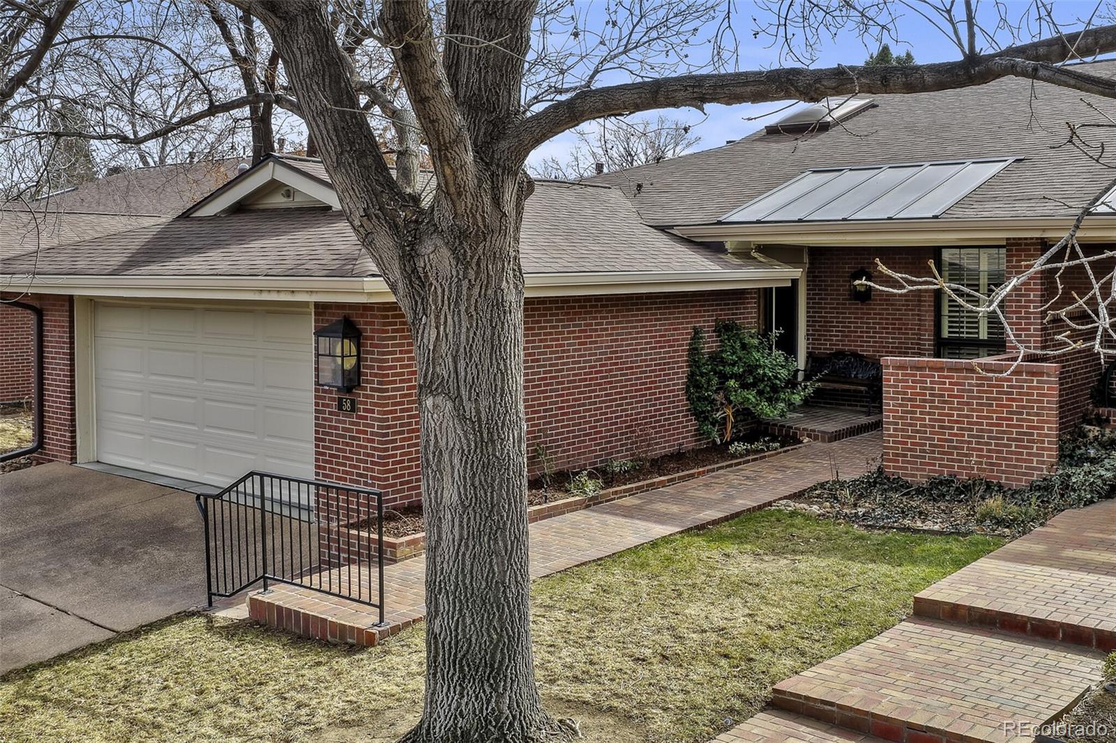 Experience refined living in this extensively remodeled luxury home in Cherry Hills III. This 4-bed, 3-bath residence showcases high-end finishes and an open-concept design ideal for both everyday living and entertaining. The fully renovated kitchen features black granite countertops, a breakfast bar, stainless steel KitchenAid appliances, double ovens, and a 5 burner gas cooktop. Walls were removed to create a seamless flow into the family room, highlighted by a beautiful gas fireplace. A convenient wet bar with a bar refrigerator enhances the home’s entertaining appeal. Throughout the home, you’ll find wood floors, solid wood interior doors, and new Pella windows and sliding patio doors, offering style, energy efficiency, and plenty of natural light. Custom window coverings complement the windows and doors* The primary suite serves as a private retreat with a walk-in closet, patio access, and a beautifully updated bath featuring a highly accessible roll-in shower. A convenient laundry closet, complete with washer and dryer, is also located within the suite* The finished basement expands the living space with a large family room and 2nd gas fireplace, two additional bedrooms (1 with a walkout door), a full bath, dedicated hobby or workout room, secondary laundry room, and a sizeable storage room. A substantial 20' x 40' sub-basement provides exceptional storage or future expansion potential. Additional updates include a newer furnace and tankless water heater*. Enjoy 3 private patios, 2 of which are enclosed with wrought-iron fencing and surrounded by lovely landscaping. As an end unit, the home sides to the East for beautiful morning sun, while the back patio faces South for year-round enjoyment. From the front patio, you can even hear the peaceful waterfall across the street. This is a rare opportunity to own a meticulously updated home in the desirable Cherry Hills III community, offering luxury finishes, flexible living space, and exceptional comfort throughout