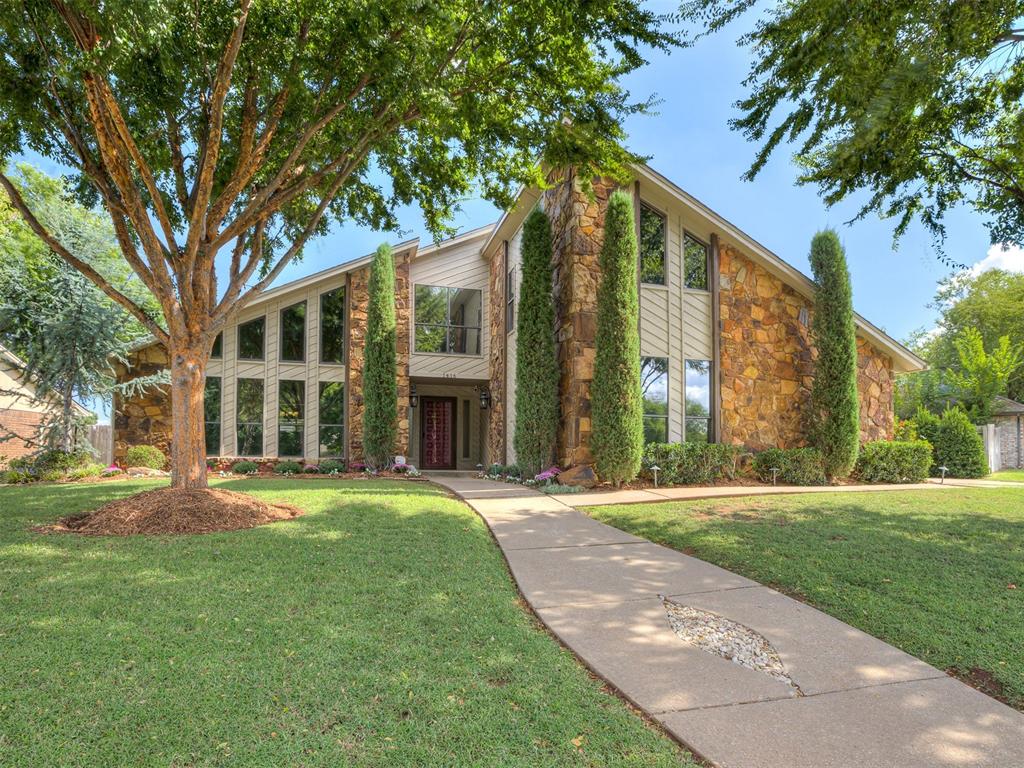 Welcome to this beautifully remodeled 4-bedroom, 3-bathroom home, ideally located directly across from a scenic park and just minutes from Quail Springs, Chisholm Creek, and the Kilpatrick Turnpike. With striking curb appeal and a charming presence, this home is sure to make a lasting impression.

Step inside to a gorgeous kitchen featuring sleek granite counters, a gas cooktop, built-in oven, and a spacious pantry. The kitchen opens to a large dining area, perfect for hosting family and friends. The entertainer's living room boasts a grand stone fireplace, geometric windows, a vaulted beamed ceiling, and hardwood floors that add warmth and character to the space.

The oversized primary bedroom is a true retreat, complete with a cozy fireplace and recessed lighting. The custom-designed bathroom features a luxurious walk-in rainfall shower with stunning tile work, creating a spa-like experience right at home.

Upstairs, you’ll find a spacious game room with a built-in bar area, along with a bedroom and a full bathroom—ideal for a second living space, guest suite, or home office.

The outdoor living space is just as impressive. Relax by the sparkling pool and soothing hot tub, or unwind in the covered outdoor living area—perfect for entertaining or quiet evenings under the stars. Mature trees provide shade and privacy, creating your own private oasis.

Additional features include landscape lighting that adds a magical touch at night, a fully automated sprinkler system to keep the yard lush year-round, a large shed for extra storage, and an 18-foot wide gate for easy access to the backyard.

With its blend of stylish upgrades, comfort, and unbeatable location, this home is a must-see! Don’t miss the opportunity to make it yours—schedule your private tour today!
