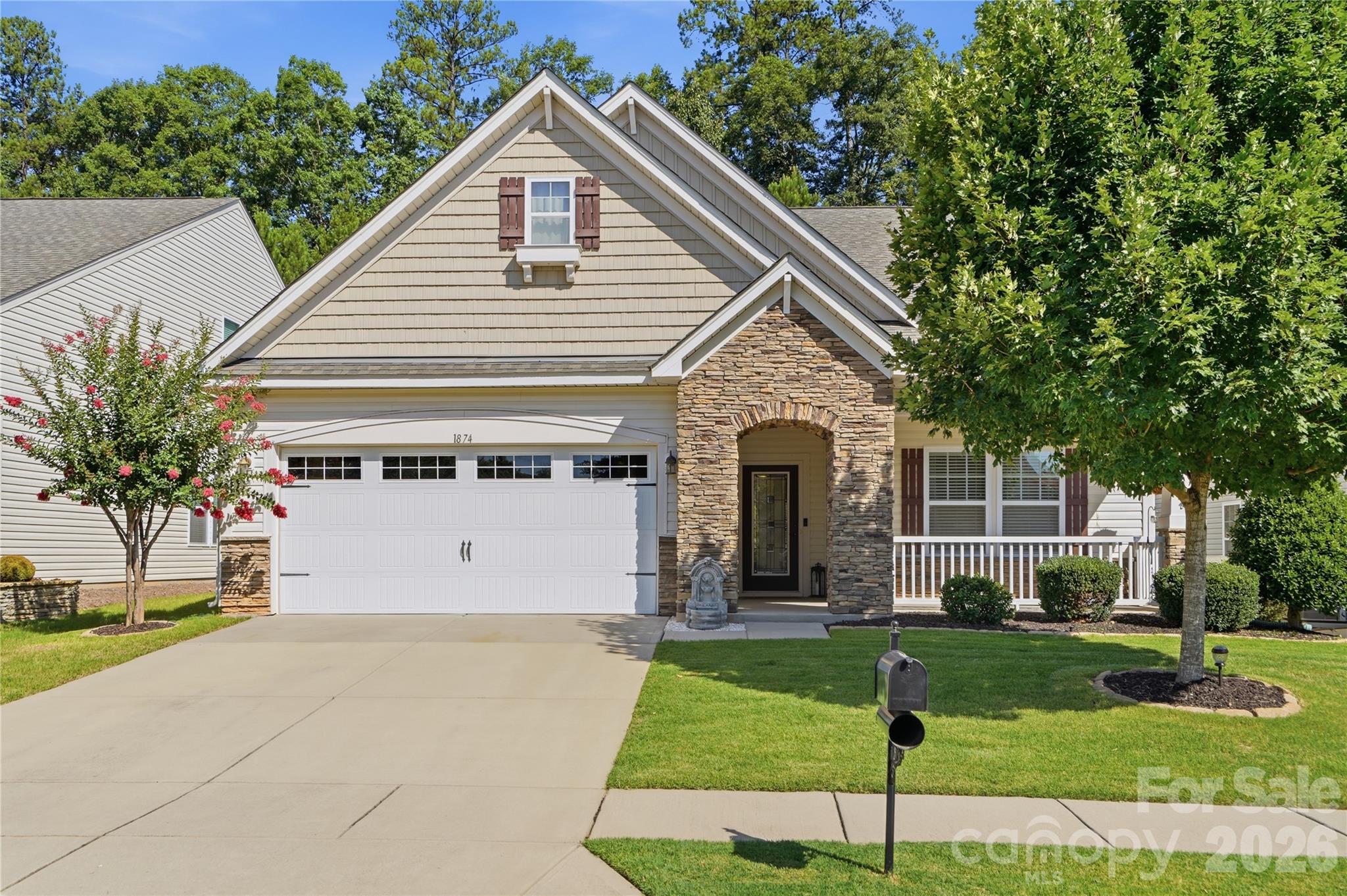 Welcome to 1874 Larkspur Way, an immaculate 1.5-story home offering the ease of main-level living in beautiful Tega Cay. Better than new and lovingly maintained, this home is a true standout with 3 bedrooms, 3 full baths, a main-level owner’s suite, flexible upper-level living space, and inviting outdoor areas designed to enjoy year-round.Step inside to a bright and open floor plan that feels warm, welcoming, and functional from the start. The spacious kitchen is designed to impress with a large center island, upgraded cabinetry, stainless steel appliances, decorative tile backsplash, walk-in pantry, and butler’s pantry. Whether you are hosting a gathering, preparing a casual meal, or enjoying time with family, this kitchen offers the space and storage you need.The main living areas flow seamlessly together, making entertaining easy. Enjoy meals in the formal dining room or keep things casual in the sunlit breakfast room. Just off the breakfast area, the screened porch creates a peaceful place to relax, while the oversized patio provides additional space for grilling, outdoor dining, or entertaining.The main-level owner’s suite is a private retreat with a cozy sitting area, generous walk-in closet, and spa-like bath featuring a soaking tub, separate shower, and dual vanity. A second bedroom and full bath on the main level offer excellent flexibility for guests, family, or a dedicated office space.Upstairs, the home continues to shine with a third bedroom, full bath, and expansive loft featuring custom built-ins. This upper-level area offers endless possibilities and can be used as a media room, second living area, craft room, playroom, home gym, or private workspace. The 1.5-story design gives you the best of both worlds: convenient main-level living with extra space when you need it.Enjoy a low-maintenance lifestyle with HOA-included lawn care, plus access to resort-style amenities including a pool, clubhouse, tennis courts, fitness center, and more. Located in Tega Cay, you are minutes from lake access, golf, pickleball, parks, trails, shopping, dining, and outdoor recreation. Clean, stylish, move-in ready, and beautifully cared for, this is a home that checks all the boxes!