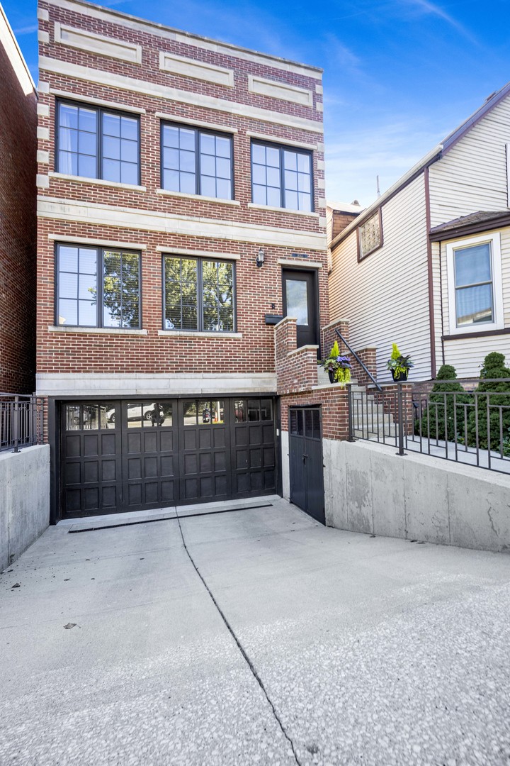 Meticulously maintained and built in 2008, this stunning Andersonville residence blends luxury, space, and an unbeatable location. Inside, you'll find walnut floors throughout, a chef's kitchen with rich walnut cabinetry, stainless steel appliances, honed granite countertops, a spacious island, and an oversized walk-in pantry-perfect for entertaining or everyday living. The sun-drenched interior features soaring ceilings and oversized windows on every level. The second floor offers three generously sized bedrooms, including a luxurious primary suite with a spa-like marble bath featuring a steam shower, rain shower head, whirlpool tub, and custom-built closets. A second-floor laundry room adds everyday convenience. The lower level expands your living space with an additional bedroom and full bath featuring double sinks and a tub-ideal for guests or extended family. There's also a spacious bonus room complete with a dry bar and beverage center, plus radiant heated floors and a second laundry area. Modern comforts abound: dual-zoned HVAC, gas fireplace, surround sound wiring, and recent updates including new roof, tuckpointing, and parapet (2024), chimney recapped and sealed (2024), and newer furnaces (2023). Outdoor living is just as impressive with a private roof deck featuring composite decking, a  landscaped backyard with newer paver patio, and an attached 2-car garage with a radiant heated driveway. All of this in a prime Andersonville location, just half a block from Clark Street's vibrant shops and restaurants, close to the CTA, El, Metra, Mariano's, parks, and only 3/4 mile to the lake.