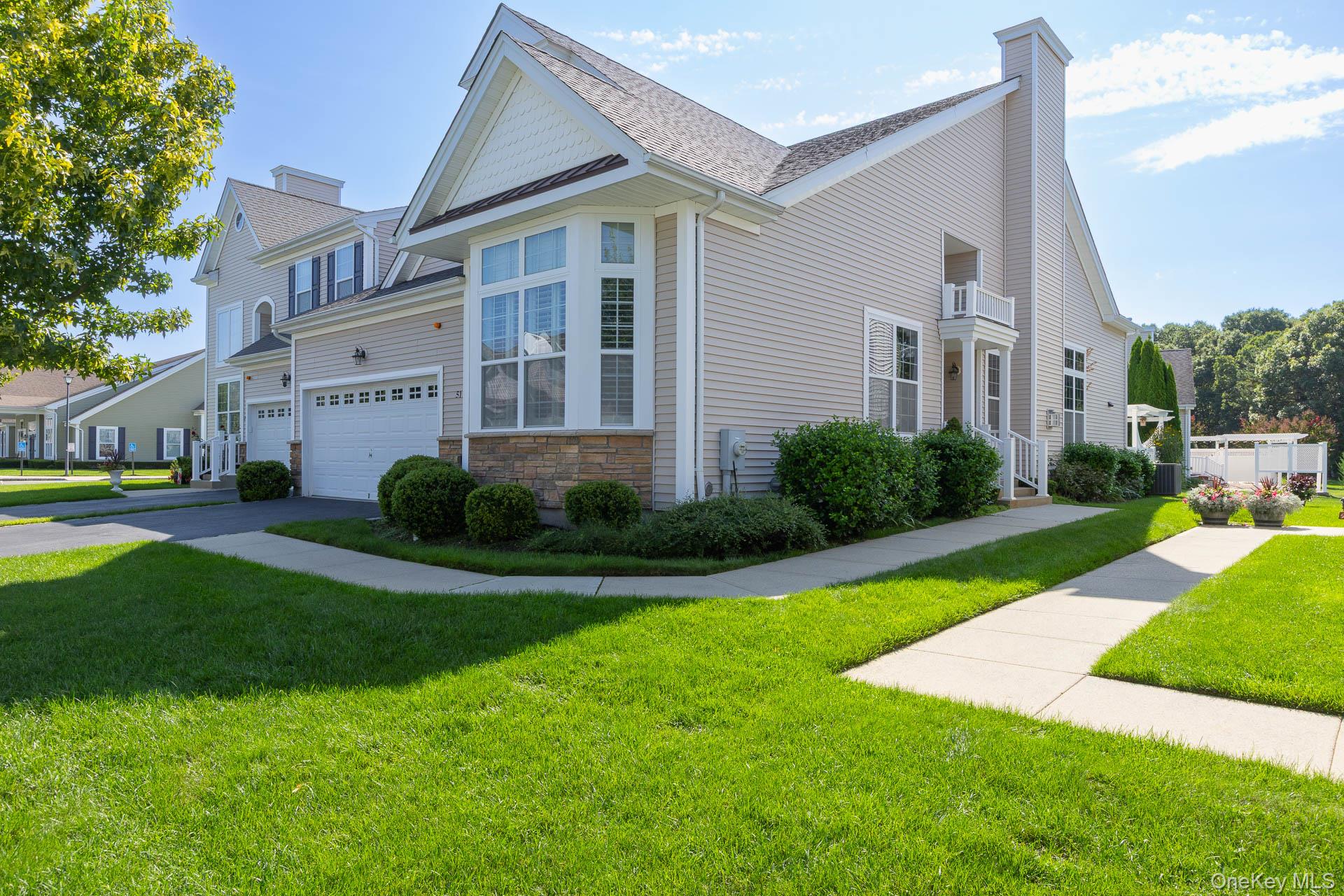 Welcome to 51 Toni Ct., a beautifully maintained Ranch style Pinot Noir Model townhouse in the Vineyards at Moriches -an exceptional community offering outstanding value among local 55+ communities. Every home here is an end unit, providing added space, privacy, and a bright, open feel with lots of windows. The comparatively low HOA fee includes numerous benefits that you won’t typically find in similar communities, making this an ideal place to enjoy an effortless, worry-free lifestyle. This home is turnkey and ready for you to move right in, with a First-floor primary suite, large, open Kitchen perfect for everyday living and entertaining. Living room with gas fireplace, dining room, large second bedroom, great for guests, a home office, or hobbies, and a full bath in the foyer. The impressive full basement is truly tremendous, featuring full-height ceilings, completely insulated walls. Plenty of room for storage and potential for future expansion. Vineyards at Moriches is a gated community with a magnificent clubhouse, including: gym, recreation rooms, heated pool, Bocce court, Pickleball/tennis court. Conveniently located with easy access to major highways and a short drive to The Hamptons. Come and buy the perfect lifestyle!