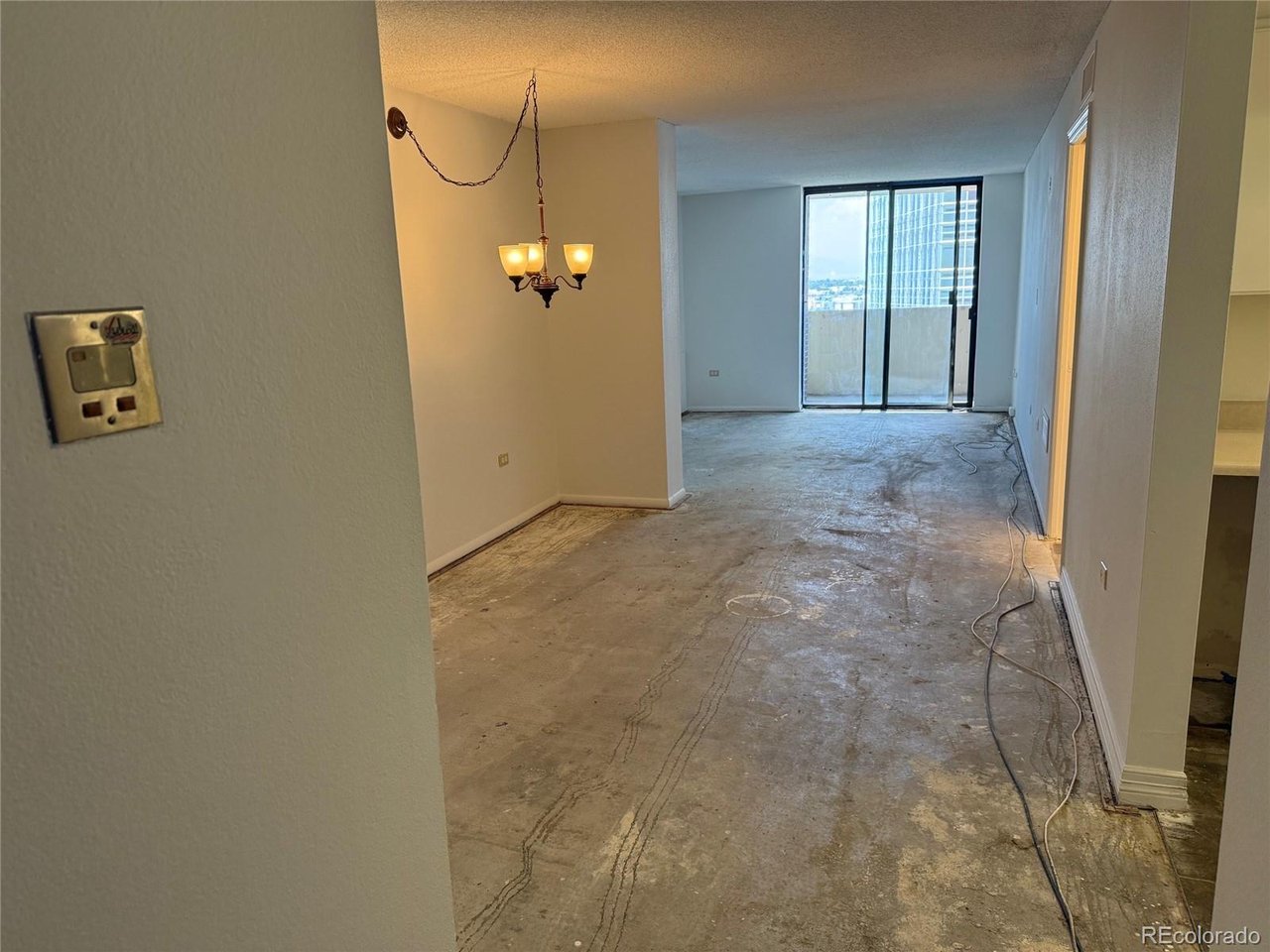 Perched on the 26th floor of Brooks Tower, this 1-bedroom Durango model offers a rare opportunity to create your dream home from the ground up. Completely stripped down to the concrete floor, this residence is a true blank canvas ready for your custom vision and finishes.The spacious living area is filled with natural light and opens to a private balcony, with a second balcony access from the bedroom, creating seamless indoor-outdoor living. Enjoy sweeping views of both the Rocky Mountains and the downtown skyline from this prime high-rise location.Whether you're an investor, contractor, or buyer looking to design a home exactly to your tastes, this is an exceptional value. This fixer-upper is priced accordingly and presents a unique chance to build equity in one of downtown Denver's most desirable residential towers.