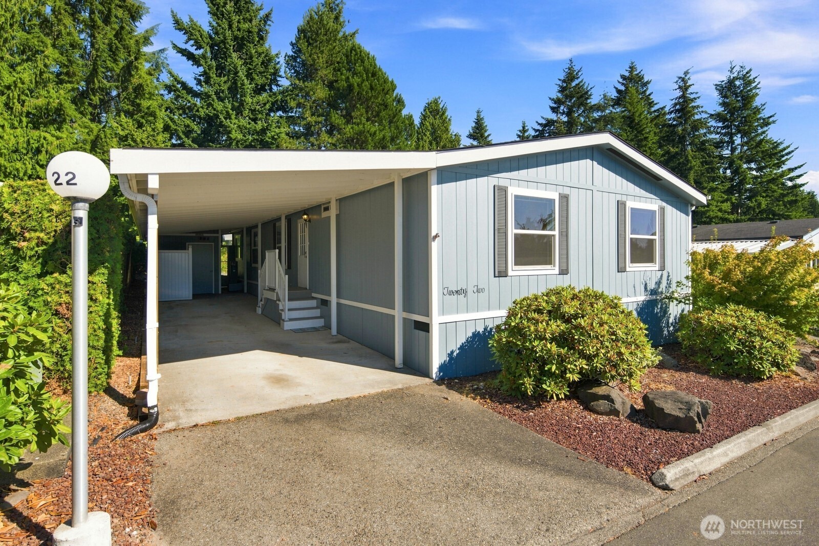 Discover elevated living in Everett’s coveted Fairway Estates, a premier 55+ gated community known for beautifully maintained grounds & exceptional amenities. This 1,495-square-foot residence is impeccably maintained w/quality finishes thru-out. Vaulted ceilings & lrg view windows fill the home w/light, while the open floor plan flows beautifully for living & entertaining. The inviting LR features beamed ceilings & fpl w/pellet-stove insert, custom surround & mantle (bags of pellets included. Formal dining room w/2 built-in hutches & credenza. Chef-inspired kitchen offers abundant cabinetry, pantry, appliances & island w/built-in dining. Primary suite features walk-in closet & ensuite bath w/easy-access tub & separate walk-in shower. Two generous guest bedrooms offer large closets. Guest bathroom w/generous walk-in shower, & laundry room w/washer, dryer, & storage complete the interior. (New furnace in 2020). Outside, the generous lot bordering the coveted 3rd tee of Walter Hall Golf Course creates a stunning private oasis. Enjoy the expansive deck, carport, & 2 outbuildings/workshops w/electricity — ideal for hobbies/projects/storage. Enjoy Fairway Estates amenities including the clubhouse, fitness center, game room, community events & park-like grounds. This home combines comfort, privacy and convenience, while ideally located near golf, dining, shopping, medical services & transit. Beautifully maintained. Exceptionally appointed. Truly move-in ready. Welcome Home!