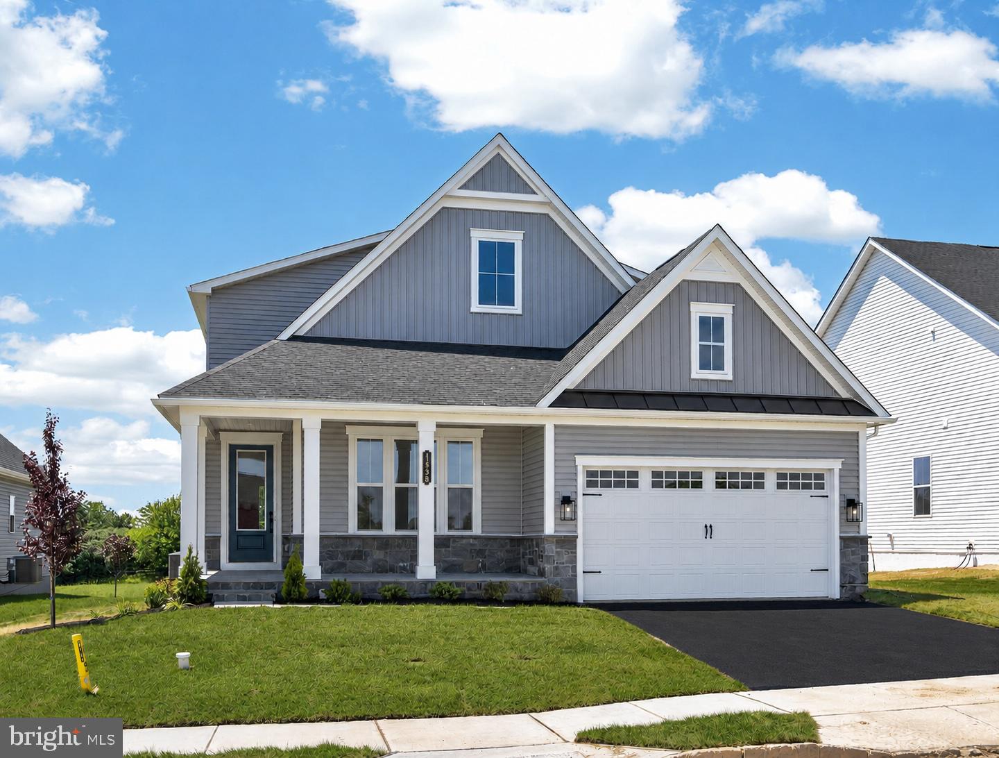 Enjoy luxury, low-maintenance living in this stunning new construction home located in the sought-after 55+ community of Brandywine Walk. Situated on a premium homesite and loaded with more than $139,000 in upgrades, this exceptional Carmel model, with finished basement, blends sophisticated design with everyday comfort. The thoughtfully designed floor plan features a desirable main-level owner's suite, soaring 9-foot ceilings, and an open-concept layout ideal for entertaining and daily living. The chef-inspired kitchen showcases a large center island, Silestone countertops, a convenient pantry, and a GE Profile Advantium wall oven. It flows seamlessly into the spacious family room, highlighted by a cozy gas fireplace. Double sliding glass doors lead to a covered rear porch featuring a second gas fireplace and a dedicated natural gas line for a grill, creating the perfect indoor-outdoor living experience. The luxurious primary suite offers a tray ceiling, two walk-in closets, and a private ensuite bath with a double-sink vanity and a beautifully tiled shower. Luxury Vinyl Plank flooring extends throughout the main level, while all bedrooms feature comfortable carpeting. Additional upgrades include ceiling fan rough-ins in all bedrooms, the Family Room, and the rear deck. Additional highlights include a welcoming covered front porch, a spacious loft, flexible lower-level living space with full bath & optional wet bar, a convenient mudroom area, abundant storage, and an oversized drywall-finished garage complete with an EV charging outlet. Paved and natural walking trails, bocce and pickleball courts are available for enjoyment now, while future community amenities will include a clubhouse and swimming pool, enhancing the active lifestyle residents enjoy. Three builder warranties provide added peace of mind. 1 yr warranty on Materials and Workmanship, 2 yrs on Installation of Mechanical Systems, and 10 yr Structural. This is a rare opportunity to enjoy brand-new construction, premium upgrades, and resort-style living without the wait.