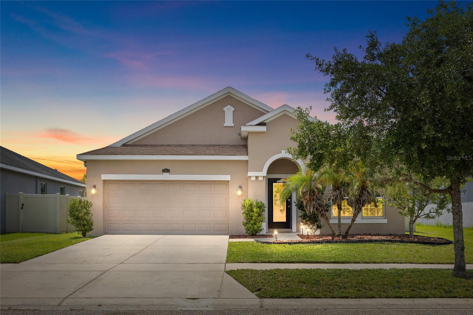Welcome to Ashton Oaks, one of Wesley Chapel's most desirable communities featuring low HOA fees and no CDD! This beautifully maintained 3-bedroom, 2.5-bath home offers nearly 1,920 square feet of thoughtfully designed living space with tranquil pond and conservation views. The open-concept floor plan features a spacious family room, formal living area, and a well-appointed kitchen with rich wood cabinetry, granite countertops, center island, and abundant storage—perfect for everyday living and entertaining.The private owner's suite offers a relaxing retreat with dual vanities, a soaking tub, walk-in closet, and serene water views. A split-bedroom layout provides added privacy for family and guests. Enjoy Florida living year-round from the covered lanai overlooking the pond and natural preserve beyond.Additional highlights include tile flooring throughout the main living areas, an inside laundry room, attached 2-car garage, and mature landscaping. Conveniently located near I-75, SR 56, The Shops at Wiregrass, Tampa Premium Outlets, AdventHealth Wesley Chapel, dining, entertainment, and top-rated schools. A rare opportunity to own a move-in-ready home with picturesque views in the heart of Wesley Chapel.