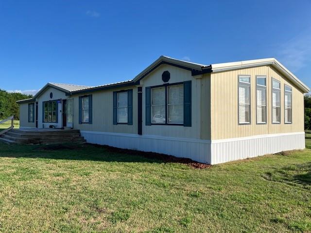 Want to experience country living without breaking the bank? Now's your chance! Well maintained 4 bed 2 bath Palm Harbor double-wide with 6 acres that's already partially fenced with a pond, concrete storm shelter, storage building, and old barn. This home originally came with a lot of extra features not normally seen in these homes such as a wood burning fireplace and a wet bar perfect for those wanting to entertain. Home was installed with permanent foundation with engineer's certification.
