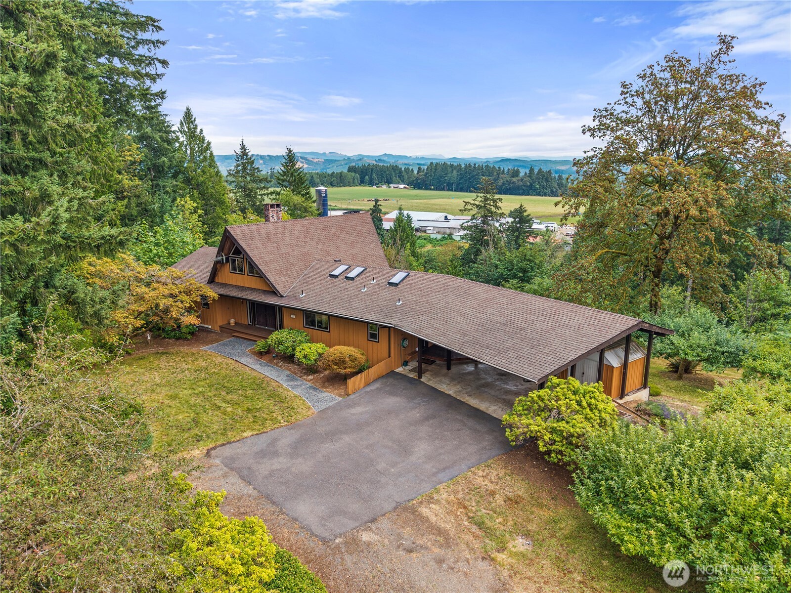 A once in a generation opportunity to own an extraordinary legacy estate where refined country living meets breathtaking natural beauty. Set behind a gated entrance on nearly 80 remarkable acres, this impeccably maintained 4,000+ square-foot custom residence commands sweeping views of Mount St. Helens, the Cowlitz River valley, and the ever-changing Pacific Northwest landscape from its expansive deck and sun-filled living spaces. Lovingly cared for by a single family throughout its history, the home blends timeless craftsmanship with thoughtful updates, including new windows, a new furnace, and a heat pump. Designed for both elegant entertaining and everyday comfort, it features grand gathering spaces, fireplaces in both the living and family rooms, a wet bar, custom built-in dining cabinetry, and a small wine cellar ready for your finest collection. Outside, the estate unfolds into an exceptional blend of natural beauty. Stroll through park-like grounds, harvest from the established orchard, cultivate the garden, or explore acres of recently replanted forest and spring-fed landscapes. Whether your passion is hiking, horseback riding, ATV adventures, wildlife watching, or simply savoring the peace and privacy, this property offers an unmatched outdoor lifestyle. Just 2.5 miles from salmon & steelhead fishing. Comprising 3 separately parceled lots, the estate presents flexibility for a multigenerational retreat, future residences, or a long-term investment opportunity.