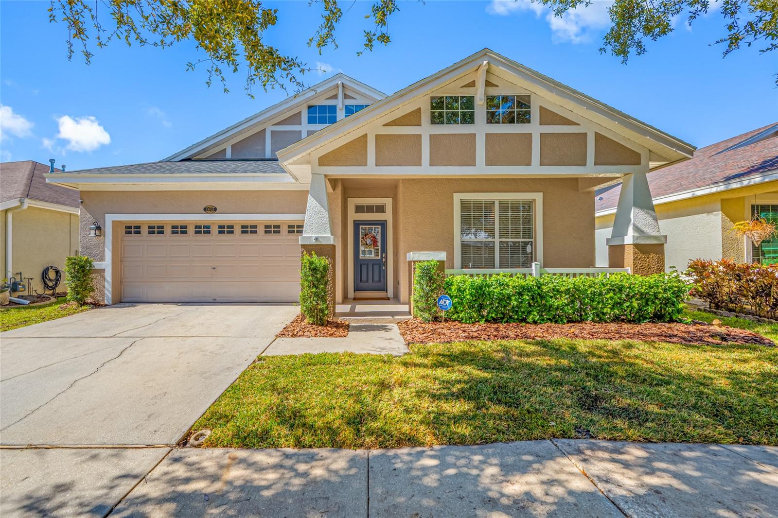 Come see this gorgeous 4 Bedroom, 2 Bath home located in the desirable community of Reflections which is situated in the sought after school district of Martinez Middle/Steinbrenner High!  From the moment arrive you will appreciate this home's character with its Craftsman design & charming front porch.  Step inside to a welcoming foyer which sets the tone for the home's light & bright feel accentuated by its light-tone luxury vinyl plank flooring throughout main living areas.  OPEN CONCEPT FLOOR PLAN features a completely REMODELED KITCHEN which has been opened up & overlooks the spacious living room.  The eat-in kitchen has been upgraded with quartz countertops with island, wood cabinets, tile backsplash, stainless steel appliances, LED lighting, & built-in bench seating in the breakfast nook.  Generous  sized primary suite features treyed ceiling, two walk-in closets, dual sinks, & garden tub with separate walk-in shower.  The flexible floor plan also includes a formal dining area (which is currently used as a game room) and separate den/office with French doors.  Step out back and enjoy relaxing on the covered lanai with extended paver patio.  Backyard is fully fenced with vinyl privacy fence.  Recent improvements in 2026 include NEW SOD and NEW CARPETING in Bedrooms 2 & 3.   HVAC SYSTEM REPLACED 2022.  ROOF REPLACED 2021.  Call today to schedule a showing!  This one won't last!