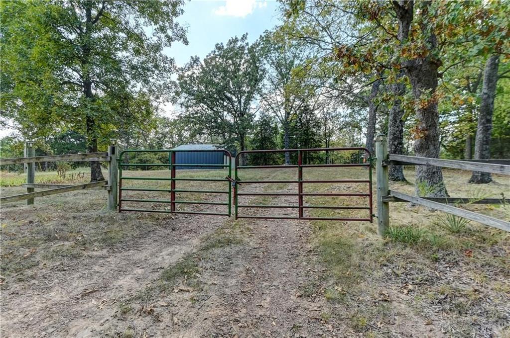 Just in time for fall and hunting season. Looking for some peace and quiet away from the city? Well you found it. Seller did all of the hard work.... now all you need to do is move in and enjoy.  This lovely 22 acre parcel has plentiful deer, turkey and a wet water creek with a small waterfall to enjoy on your evening strolls.  2024 Clayton Homes Cumberland Park Model converted to a 1 bedroom 1 bath with eat in kitchen and living room. Newer 200 amp service and pole installed. Water well with filtration system installled in 2025 and has expansion room. 1000 gallon septic system installed in January 2026.  24 X 27 Polebarn built in 2024 with a Full RV hookup to access all of the utilities. Dont miss this move in ready gem ready for your weekend get aways!