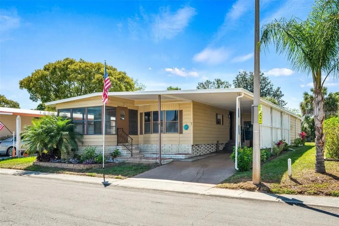 WOW! This Light & Bright Home shows pride of ownership and located in friendly community with plenty of activities. This partially furnished home has an oversized back yard. There is also a room with storage and washer/dryer hookups and separate workshop/office. The updated Kitchen has stainless steel appliances, along with pantry and Breakfast bar. The Kitchen opens to a Bonus or Family Room. Luxury vinyl throughout. Dining room has an attractive built-in unit with drawers, cabinets, shelves & bar. Very open floor plan with large Living Room, along with Florida room with serene views. Spacious Master Bedroom has 2 closets, including one walk-in closet. Lovely vanity with makeup area in Master Bath, along with walk-in shower. Activities include Bingo, Cards, Cribbage, Line Dancing, Happy Hour and more! Close to Honeymoon Island Beach, restaurants, grocery, golf & more! Don’t miss out, Come View Today!