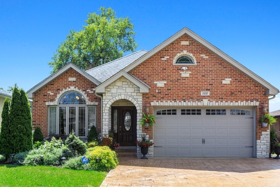 A gorgeous twist on a split level, be prepared to be "wowed" by this luxurious brick/stone split level. Soaring ceiling heights in the kitchen with custom cherry cabinets, oversized granite countertop island, skylights, and stainless steel appliances. Tray ceilings with impeccable detail in staircase and dining room. Spa like bathroom with step up jacuzzi and walk in shower. An entertainers dream back yard with deck and pergola. Fully equipped with smoker, chimney, grill and beverage cooler! This one of a kind, custom home has all the bells and whistles!