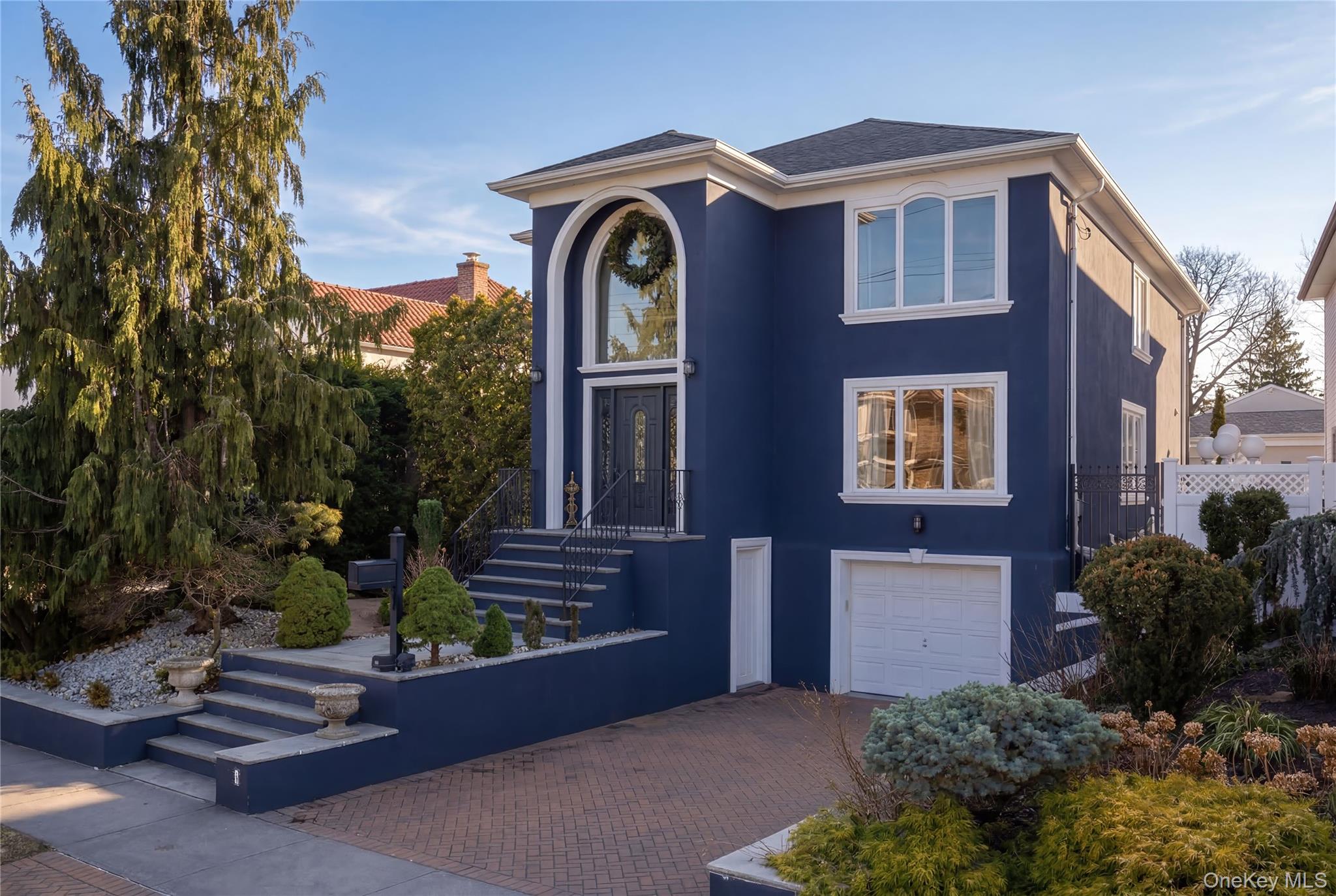 Fantastic Location, located in the great enclave of Malba and exclusive prestigious neighborhood, just few blocks from the water.  This custom-built Gem features top class amenities, was rebuilt in 2007, with a fabulous entryway features expansive twenty "20 ft" vaulted ceilings, home boasts four bedrooms and four full bath, with two doubled glass doors to the back yard.  The kitchen is equipped with high end appliances and granite floors, with an island quartz countertop.  A formal living room, dining room and family room with lots of space for entertainment.  Beautiful huge primary bedroom suite full bath & two walk in closets.   Another bath boasts jacuzzi tub and shower.  The walk in floor full plenty of space for guests and extended family.  Pella and Anderson windows, surround sound system, central vacuum system, hydronic & hot water system.  House is fully insulated.  Close to public transportation, shops, great restaurants, highways etc.  All smiles a must view.