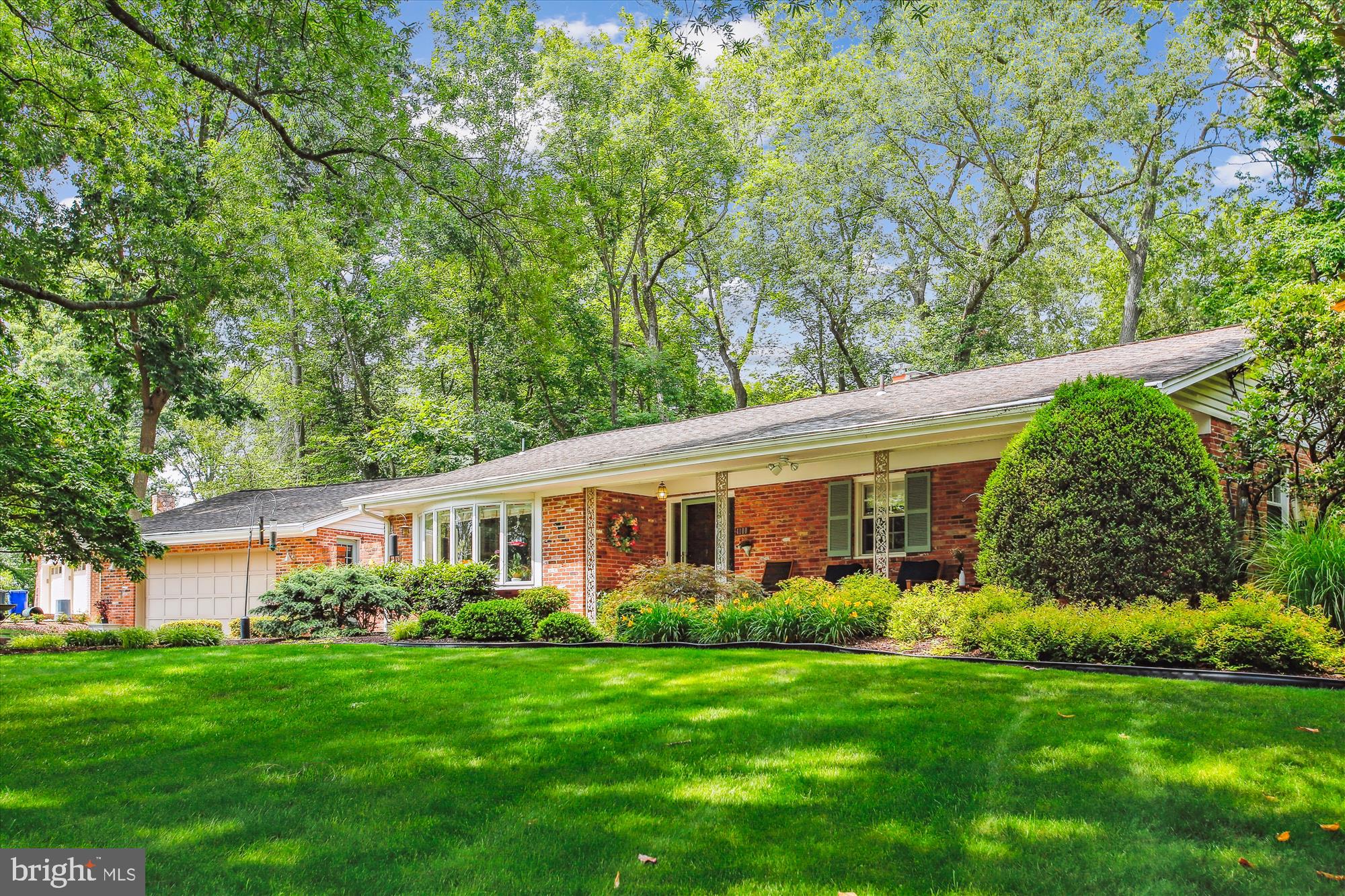 Welcome home to this beautifully maintained, light-filled, 2-level corner property nestled in a cul-de-sac offering peace and minimal traffic on a half-acre lot in Mount Vernon Forest.  Complete with 4 bedrooms, 3 full baths, ample STORAGE, and mature landscaping, this home perfectly blends classic charm with modern amenities and incredible outdoor entertainment. The main level OPEN FLOOR PLAN boasts gleaming hardwood floors, an updated eat-in kitchen with granite countertops and gas cooking, and two spacious bedrooms (including the primary suite). Cozy up to one of the TWO wood-burning fireplaces (one on each level!). Enjoy seamless indoor/outdoor living with an EXPANSIVE REAR DECK, hardscape patio, and a stunning GAZEBO featuring a HOT TUB. Recently refreshed with new paint and new carpet in the bedrooms, plus a gorgeous breezeway connecting to the OVERSIZED detached garage, this home is truly move-in ready and the perfect place to start your next chapter.