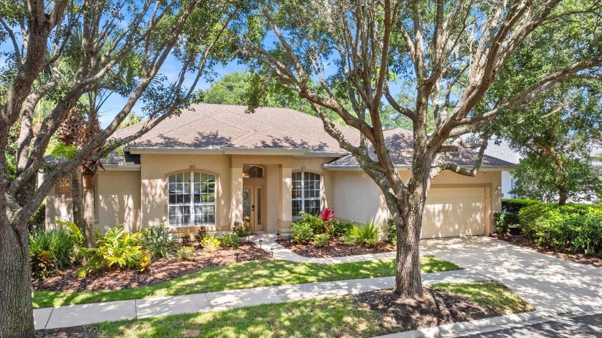 Welcome to a residence where every corner is designed with comfort and sophistication in mind, nestled within the luxurious Grand Haven community of Palm Coast. This stunning three-bedroom home, complete with an office and two bathrooms, offers a serene retreat with breathtaking views of the preserve and golf course frontage.
Upon entering, you are immediately embraced by an open great room floor plan, where engineered wood floors and tasteful tile provide a seamless transition between spaces. The home is bathed in natural light, thanks to the 8-foot stackable sliders and single French doors that lead to the inviting pool area, complete with a large covered lanai. 
The recently remodeled kitchen is a chef's dream, showcasing exotic leather granite countertops and Whirlpool black stainless appliances. The walk-in pantry, equipped with wood shelving, adds both elegance and practicality to this culinary haven.
The luxurious owner's suite is a true sanctuary, featuring a spacious walk-in closet and sliders that lead directly to the pool area. The en-suite bathroom offers indulgence with a jetted tub and a walk-in shower. 
Guests will appreciate the privacy offered by the split floor plan, where the secondary bedroom and bathroom provide a private retreat. The secondary bathroom also features a convenient pool area service door. 
For added peace of mind, the home is equipped with a new security system and surveillance cameras, ensuring safety both inside and outside. This isn’t just a home—it’s a lifestyle of elegance, privacy, & resort-style living in one of Palm Coast’s most sought-after communities.