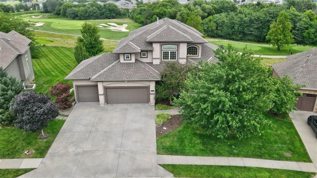 Welcome to this stunning 6-bedroom, 5.1-bathroom estate offering over 4,200 square feet of refined living space in one of Raymore’s most sought-after neighborhoods. From the moment you arrive, you'll be captivated by the elegant curb appeal, meticulous landscaping, and timeless architecture.

Step inside to soaring ceilings, rich hardwood floors, and an open-concept layout designed for both entertaining and everyday comfort. The gourmet kitchen features high-end stainless steel appliances, granite countertops, a spacious island, and custom cabinetry—all flowing seamlessly into a grand living area anchored by a statement fireplace.

The main-level primary suite is a true retreat with a spa-inspired en-suite bath, dual vanities, soaking tub, and generous walk-in closet. Upstairs, you'll find additional bedrooms with ample space and natural light, including a versatile guest suite and a large bonus/media room.

The fully finished lower level offers even more space to relax or entertain, complete with a second living area, wet bar, and additional bedrooms—perfect for multigenerational living or hosting guests.

Outdoors, enjoy your private backyard oasis with a covered patio, ideal for year-round enjoyment.

Located just minutes from top-rated schools, shopping, and parks, this home effortlessly combines luxury, comfort, and convenience.

18-hole championship golf course and a private 108-acre lake, perfect for fishing, kayaking, and paddleboarding. Residents enjoy a clubhouse with dining, a fitness center, walking trails, tennis courts, and a resort-style pool with a pavilion. The community offers year-round social events and a welcoming, family-friendly atmosphere. With beautifully designed homes and easy access to shopping, schools, and highways, Creekmoor blends luxury living with everyday convenience.