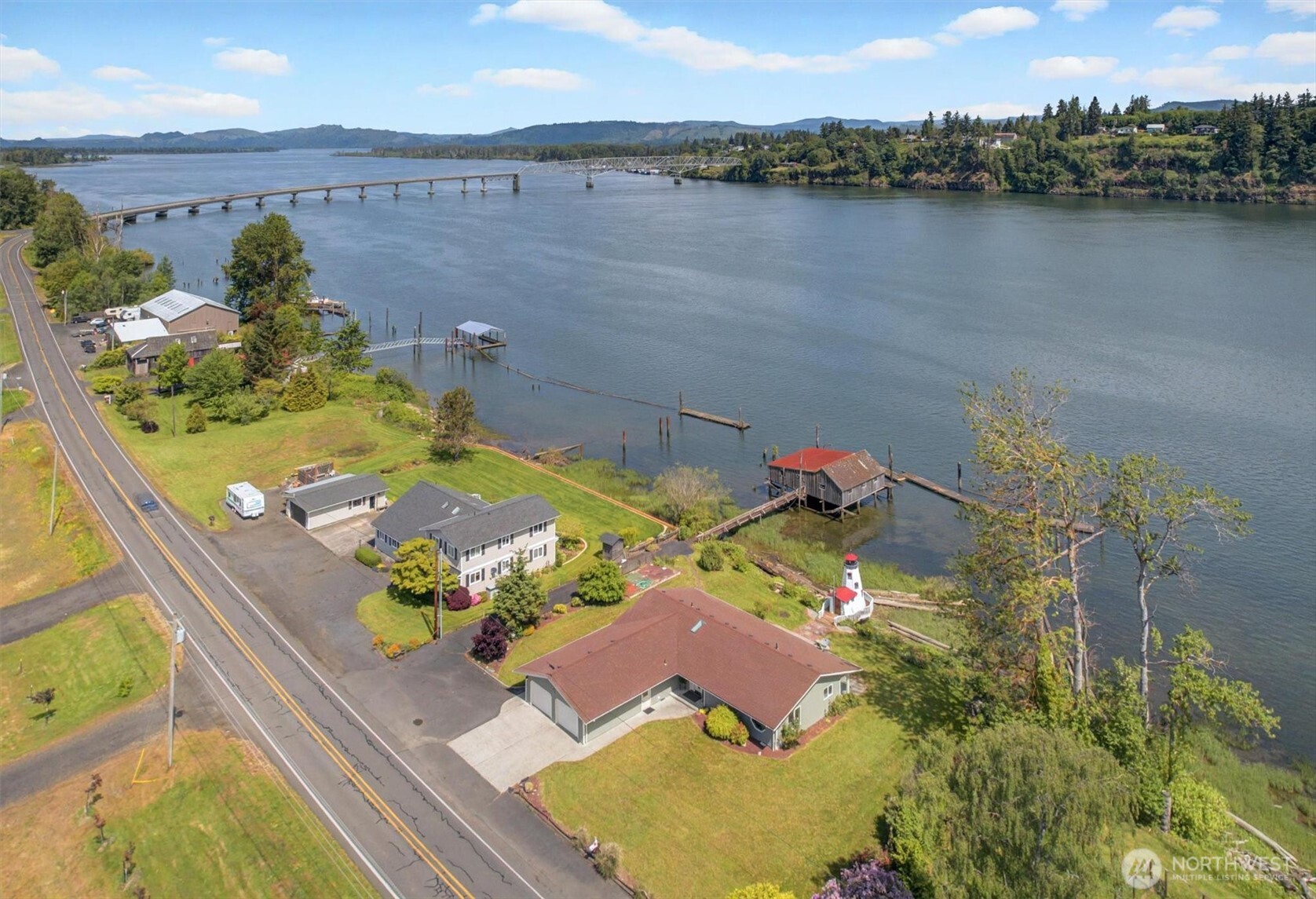 Live on the water’s edge and enjoy the pace of island life in this updated, turn key riverfront home on the Lower Columbia. Designed to appreciate the fabulous location with water views from every living space, the single-level, three bedroom offers private patio access from the great room, primary suite and the eastern bedroom. The custom and charming lighthouse offers additional space for work or play. Become a custodian of the past as the property includes one of the last historic gillnetter net houses on the Columbia River, including an original wood blue stone tank. Pilings and floats are in place; add a gangway and moor your boat steps from your backdoor. Just moments from downtown Cathlamet but a world away.