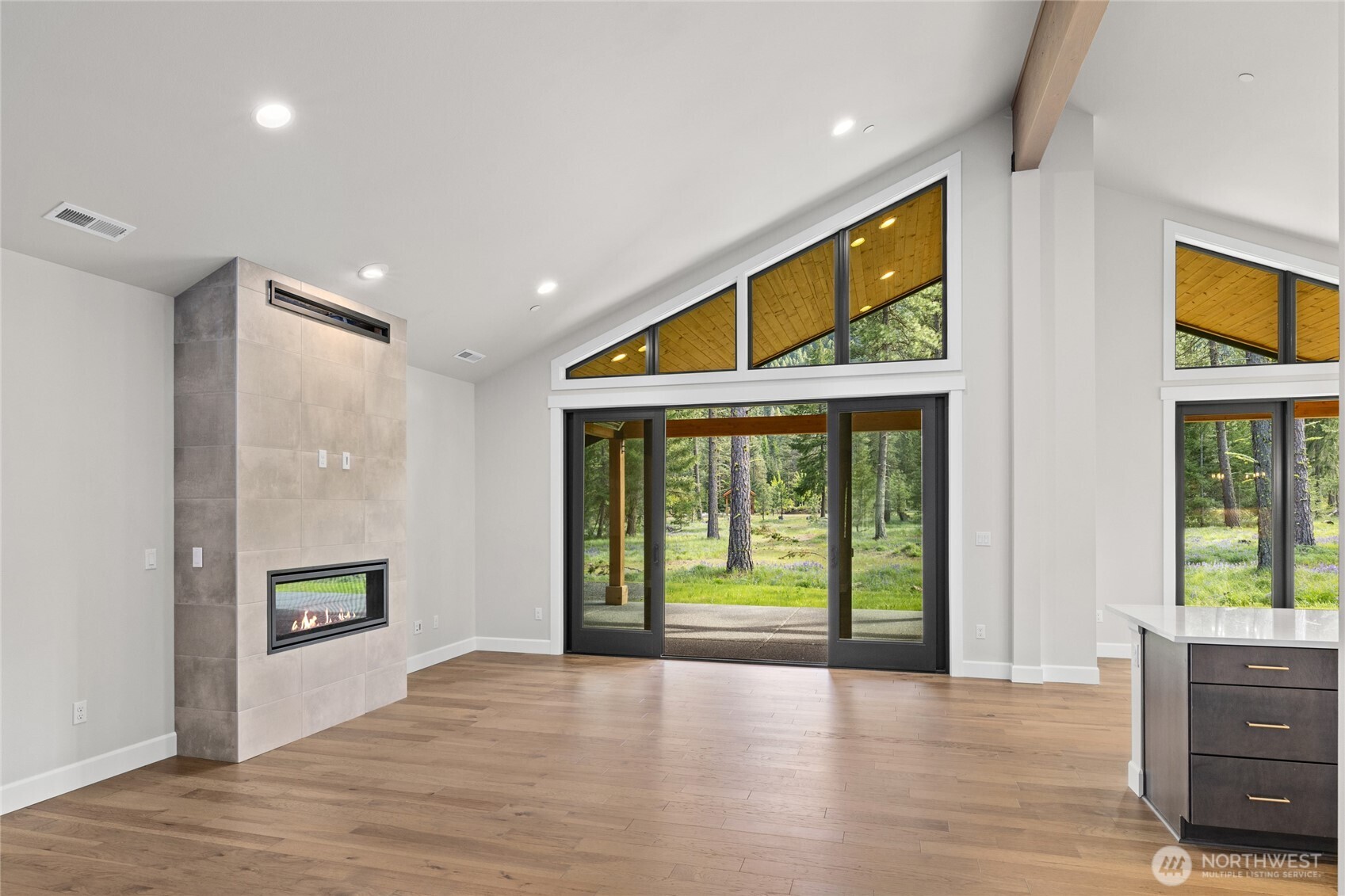 Soaring ceilings and hardwood floors throughout the kitchen and great room.