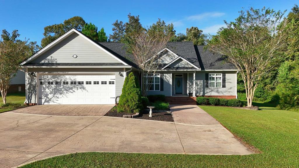 Welcome home to 396 Carrington Circle, located in the highly sought-after Hunters Cove subdivision—just minutes from downtown Thomasville! Nestled on a generous 1.54-acre lot, this beautifully maintained home offers the perfect blend of space, comfort, and convenience. Step inside to discover a well-designed split floor plan featuring 3 spacious bedrooms and 2 full bathrooms. You'll immediately notice the high ceilings and updated luxury vinyl plank flooring that flow throughout the home, adding style and warmth to each room. The heart of the home is the open-concept living area, where the large living room seamlessly connects to the kitchen and the formal dining room—perfect for entertaining or relaxing with family. The kitchen features a pull-up breakfast bar, ample cabinet space, and a cozy breakfast nook for casual dining. The primary suite is truly a retreat, offering a generous layout complete with a sitting area—ideal for reading, working, or simply unwinding. The ensuite bath includes double vanities, a soaking tub, and a separate shower, giving you all the comfort you need to start and end your day. Step outside to enjoy the peaceful backyard from your covered porch or host gatherings on the custom paver patio overlooking the expansive lot. Additional Highlights: Large guest bedrooms Oversized dining space Quiet neighborhood setting Just a short drive to shopping, dining, and schools. Don't miss your chance to own this wonderful home and give us a call today to set up your private tour!