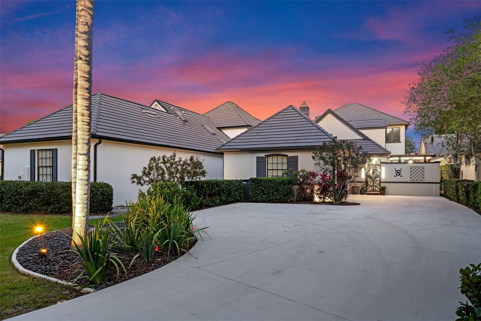 OWNER FINANCING AVAILABLE! Beautiful home in tranquil Lake Nona Estates. Exclusive, Gated Country Club living at its best!  This home is on the 3rd hole...why watch golf on TV when you can watch professional golfers from your back patio! This courtyard home sits on almost a 1/2 acre of property and has 4 generously sized bedrooms - all ensuite!  Two of the bedrooms can be main bedrooms so you can choose to be upstairs or downstairs!  Ample walk-in closets, too!  Upstairs has a total of 3 bedrooms and 2 bonus rooms - one is being used as a living area and one as a bar area.  PLUS, TWO balconies overlooking the lush landscape and golf course. The gourmet kitchen is truly a one of a kind with lots of custom features including TWO copper sinks, TWO dishwashers, an additional smaller, copper sink perfect to fill with ice to store your drinks while entertaining, PLUS, a large wine fridge, built-in ice maker, and desk. The spacious living room is warm and inviting with a wall of built in bookcases to showcase all your family photos and provides access to both the courtyard and back lanai. The paver courtyard is ideal for indoor/outdoor living with a pool and new outdoor kitchen with motorized louvered roof.  There is also an additional screened in lanai out back overlooking the spacious yard with brick paver patio in the shade of a large oak tree. 

Lake Nona Golf and Country Club offers private country club living...A premier club offering golf, tennis, pickleball, a fitness center, daycare, a restaurant, access to the lake via boat ramp with dock, boat storage, and more! You can choose between a Social or Golf Membership.

A-rated schools, minutes to Orlando International Airport, Medical City, USTA National Campus, Lake Nona's many delicious restaurants, and so much more! Multiple, easy accesses to 417 and 528 to make your commute to Orlando, the beach, or the theme parks convenient!