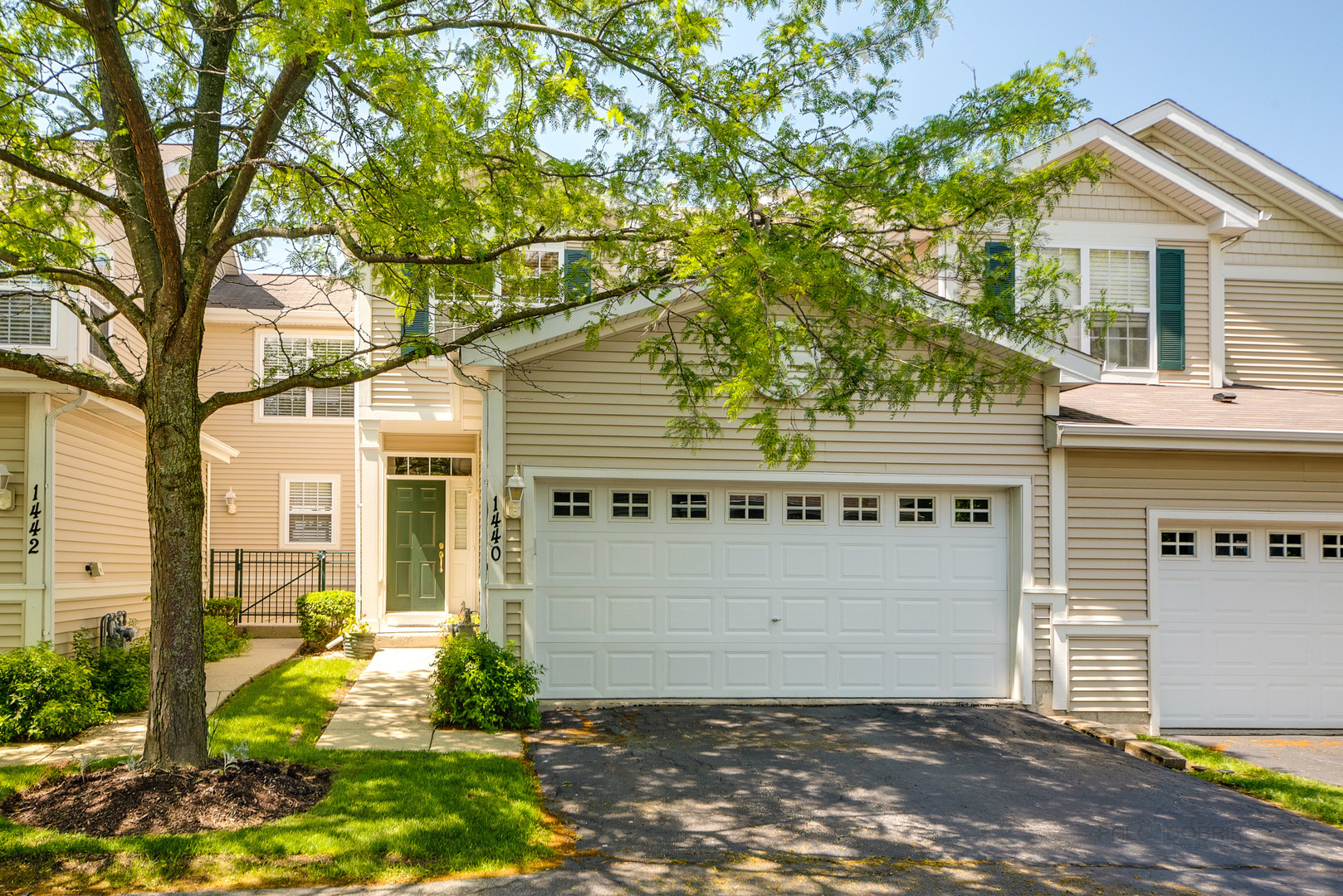 Rarely available Riverton model townhome features wall-to-wall hardwood floors.  This 2-bedroom, 2.5-bathroom plus LOFT townhome features a walk-out basement to the forest preserve and a 10X10 deck. Main floor features an open layout, living room with cozy fireplace, dining room, half bath, kitchen with stainless steel appliances, and spacious laundry room.   Master suite offers a walk-in closet, soaker tub, double sinks, and magnificent views. The Loft could be a 3rd or perfect upstairs family room or office. Finished basement with amazing cinema theater system and walkout to the outside green space. Meticulously maintained, move-in ready great townhome.