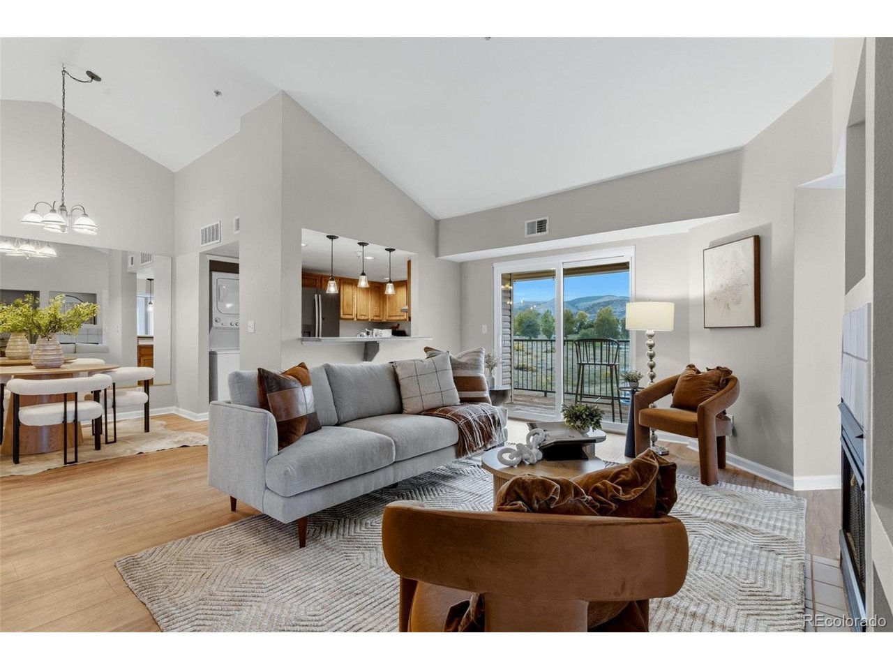 Welcome home to top-floor comfort in the heart of West Littleton at 12304 W Cross Dr, Unit 301. Perched on the third floor with high vaulted ceilings and no living space above, this light-filled condo features an airy, open layout with a cozy gas fireplace, an in-unit washer and dryer, and a private balcony framing sweeping, panoramic views of the Rocky Mountains over open green space. The property comes complete with a sought-after detached garage-offering ideal extra storage space for outdoor gear alongside protection from winter snow-plus an additional reserved parking spot. Brand new flooring throughout and fresh paint make this home move-in ready! Nestled in a well-maintained community boasting a refreshing outdoor pool, relaxing hot tub, fitness center, clubhouse, and scenic walking trails, you'll enjoy a low-maintenance, resort-style lifestyle. The unbeatable foothills location puts endless outdoor recreation at your doorstep-just minutes from Red Rocks Amphitheater, Bear Creek Lake Park, and Mount Falcon hiking-while offering quick access to C-470 and US-285 for effortless commutes to Denver, the Tech Center, or straight into the mountains.