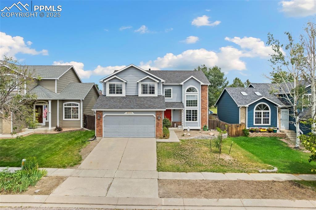 This beautifully maintained home offers a versatile layout with five bedrooms, four bathrooms, and a dedicated main-floor workspace complete with built-ins and French doors ~ The kitchen is sleek and functional, featuring granite countertops, contemporary backsplash detailing, and stainless appliances, and it flows seamlessly into the main living area anchored by a charming fireplace ~ Large windows and soaring ceilings create a sense of openness, while the upstairs overlook adds architectural interest and connection between levels ~ The primary suite is a true retreat, offering a generous layout and 5 piece en suite with modern finishes ~ 2 additional upstairs bedrooms and an updated full bath provide space and comfort for all ~ The finished lower level provides bonus space for media, fitness, or guests, along with extra room for storage. The backyard is a true retreat, featuring a concrete patio, raised garden beds, a gazebo for shaded relaxation, and direct access to a quiet walking path ~ A storage shed adds functionality for outdoor tools and gear ~ Thoughtful extras include a sun-facing driveway, central air, hardwoods on the main level, and a sprinkler system ~ Major updates include a new roof and water heater in 2023, offering peace of mind for years to come ~ Best of all—there’s no HOA, giving you freedom and flexibility rarely found in such a prime location ~ Set within a well-established neighborhood known for parks, trails, and top-rated schools ~ Conveniently located with easy access to commuter routes, shopping hubs, and dining options ~ This is a home that checks every box for comfort, convenience, and everyday living.