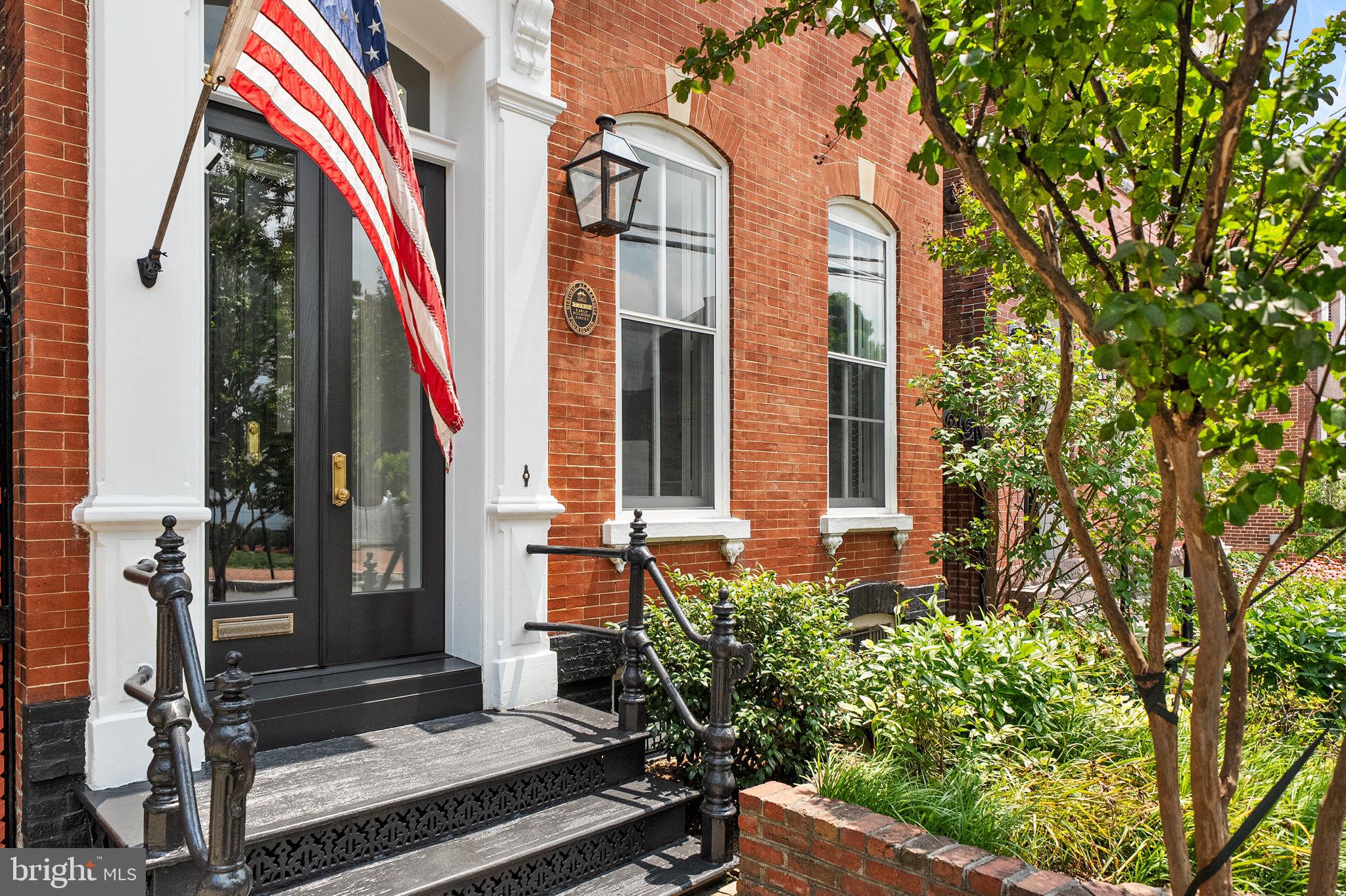 Steeped in history yet thoughtfully reimagined for modern living, this exceptional detached residence, originally built in the 1880s, seamlessly blends timeless architecture with sophisticated luxury. Following an extensive renovation and expansion completed between 2022 and 2025, every detail has been meticulously curated to honor the home's historic character while introducing today's finest finishes and amenities. Spanning nearly 3,200 finished square feet, the home offers four to five spacious bedrooms, three full and one half baths, and beautifully proportioned living spaces with soaring ceilings, oversized windows, and an abundance of natural light. The striking rear addition is defined by a dramatic wall of rare floor-to-ceiling black Marvin windows and doors, creating a stunning architectural statement while seamlessly connecting the interior living spaces to the private rear courtyard. The expanded kitchen and family room serve as the heart of the home, thoughtfully designed for both everyday living and effortless entertaining. The chef's kitchen showcases custom inset cabinetry, Honed Danby marble countertops and full-height backsplash, herringbone hardwood flooring, high-end hardware and fixtures, and a premium suite of Wolf and Sub-Zero appliances, including a paneled refrigerator and dishwasher, built-in espresso/coffee maker, and wine refrigerator. The thoughtfully designed addition introduced a versatile upper-level bedroom or second family room, further enhancing the home's adaptable floor plan. The upper levels offer exceptional flexibility, with the ability to create multiple bedroom configurations, including two distinct primary suite options, private offices, or additional living spaces. Front and rear staircases provide seamless access between the main and upper levels, while a convenient bedroom-level laundry room further enhances the home's thoughtful design and everyday livability. Throughout the residence, refined finishes and bespoke details elevate every space. Original hardwood floors have been beautifully refinished, complemented by new hardwood flooring, elegant millwork and built-in cabinetry, designer lighting and wallpaper, a timeless Benjamin Moore neutral paint palette, plantation shutters, and fully renovated bathrooms appointed with designer finishes. Modern conveniences, including new custom-crafted interior doors with crystal "Old Town" knobs and custom-built front and side entry doors, have been seamlessly integrated while preserving the home’s historic integrity. Outside, the private rear courtyard has been transformed into a tranquil outdoor retreat featuring full-color flagstone hardscaping, automatic landscape lighting, and discreet built-in storage. A rare private alleyway and side entrance further enhance both privacy and convenience, while an additional 500 square feet of basement storage with both interior and exterior access provides exceptional functionality. In addition to the improvements and renovations throughout, all major systems have been updated. Perfectly positioned in the heart of Old Town Alexandria, 220 S. Fairfax Street offers the rare opportunity to experience historic charm paired with every modern luxury. Located on one of the most coveted blocks in the Southeast Quadrant, the home is just one and a half blocks from King Street and only three blocks from the scenic Potomac River waterfront, placing acclaimed restaurants, charming cafés, boutique shopping, vibrant neighborhood parks, and the very best of Old Town just moments from your front door.