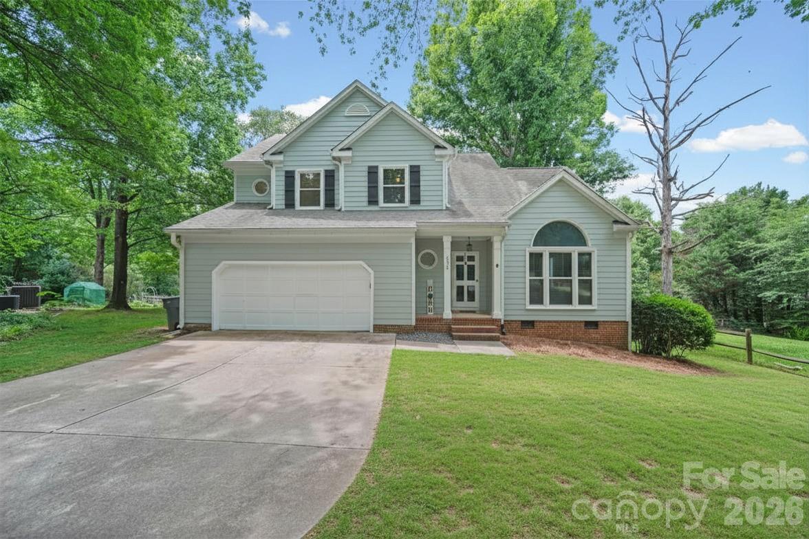 Nestled at the end of a peaceful cul-de-sac in the highly regarded Wellington community, this beautifully refreshed 3-bedroom, 2.5-bath home blends modern updates with warm, inviting living spaces. Thoughtfully maintained and stylishly upgraded, it offers a move-in-ready experience in one of Charlotte’s most convenient and established neighborhoods. Inside, the main level features an open, flowing layout anchored by a bright living area and a spacious kitchen that has been fully remodeled with contemporary finishes. Sleek cabinetry, updated countertops, modern fixtures, and stainless-steel appliances create a clean, elevated look that pairs perfectly with the adjoining dining and family spaces. Large windows throughout the main floor bring in abundant natural light and frame views of the private backyard. Upstairs, the primary suite is a standout, showcasing a luxuriously remodeled bathroom with a double-sink vanity, framed mirrors, upgraded lighting, a glass-enclosed shower with designer tilework, and a freestanding soaking tub that adds a spa-like touch. A generous walk-in closet completes the suite. Two additional bedrooms share a well-appointed full bath and offer flexibility for guests, a home office, or a nursery. Outdoor living is easy with a deck and patio area perfect for morning coffee or evening gatherings. The cul-de-sac setting provides added privacy and minimal traffic, making the home feel tucked away while still being minutes from shopping, dining, parks, and major Charlotte conveniences. This Wellington gem combines thoughtful updates, modern style, and a fantastic location — a rare find in today’s market.