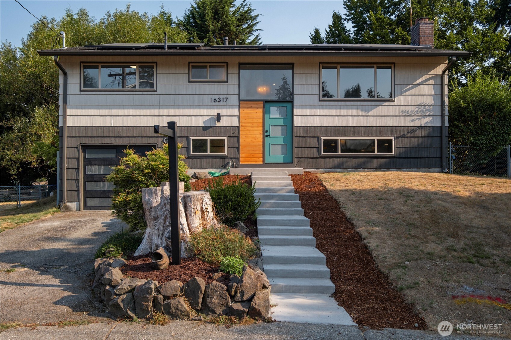 Tucked quietly at the end of a serene, low-traffic cul-de-sac, this beautifully transformed 4-bedroom, 2-bathroom split-entry home  seamlessly combines modern comfort, energy efficiency, and everyday functionality.  Every inch has been upgraded for quality and longevity, including modern kitchen and bath updates, a brand-new second bathroom, new electrical panel and timeless finishes throughout. All fully permitted with city of Renton. The lower level features a separate entrance, offering ideal flexibility for a large household, multigenerational setup, or an ADU conversion. Say goodbye to high utility bills with 15 solar panels (paid-off) for year-round energy savings. Also equiped with central A/C (heat pump), an EV charger, and dedicated RV or recreational toy parking. Located within walking distance to Lindbergh High School, and just minutes from main roads, parks, shopping, and Fairwood library. Welcome home!