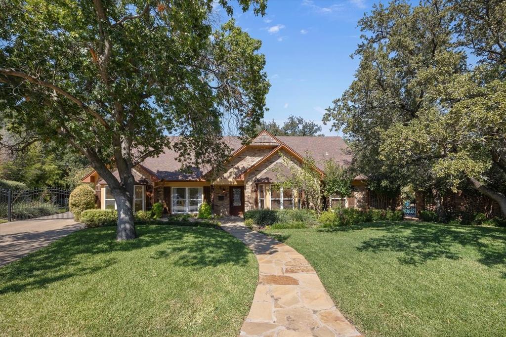 Nestled at the end of a quiet cul-de-sac in one of Fort Worth’s most sought-after neighborhoods, this expansive residence offers almost 6,200 square feet of living space on nearly half an acre, zoned to acclaimed Overton Park Elementary. Designed for both grand entertaining and everyday living, the home features six bedrooms, five full and one half baths, and four spacious living areas. Enjoy multiple gathering spaces including a formal living, den with fireplace, family room with wet bar, and an oversized game room that easily accommodates a pool table and more. The formal dining and breakfast rooms provide flexibility for both casual and elegant meals. Upstairs, the primary suite is a true retreat with its own fireplace, four closets, a private office with abundant storage, and an adjacent bedroom with it's own ensuite bath—perfect for a nursery or private guest suite. There is hallway access to this guest room in addition to the primary suite. The backyard is an oasis with a sparkling pool, spa, lush landscaping, and three distinct outdoor areas for entertaining or relaxing. Mature palms, multiple bay windows, and generous natural light create a warm, inviting atmosphere. Additional highlights include a bathroom with pool access, a copper farmhouse sink, abundant parking behind the gated drive, as well as an attached two-car garage. With its remarkable square footage, flexible floor plan, impressive footprint in the center of the pie shaped lot, and prime location, this property presents an incredible opportunity to customize and create a dream home in the heart of Fort Worth.