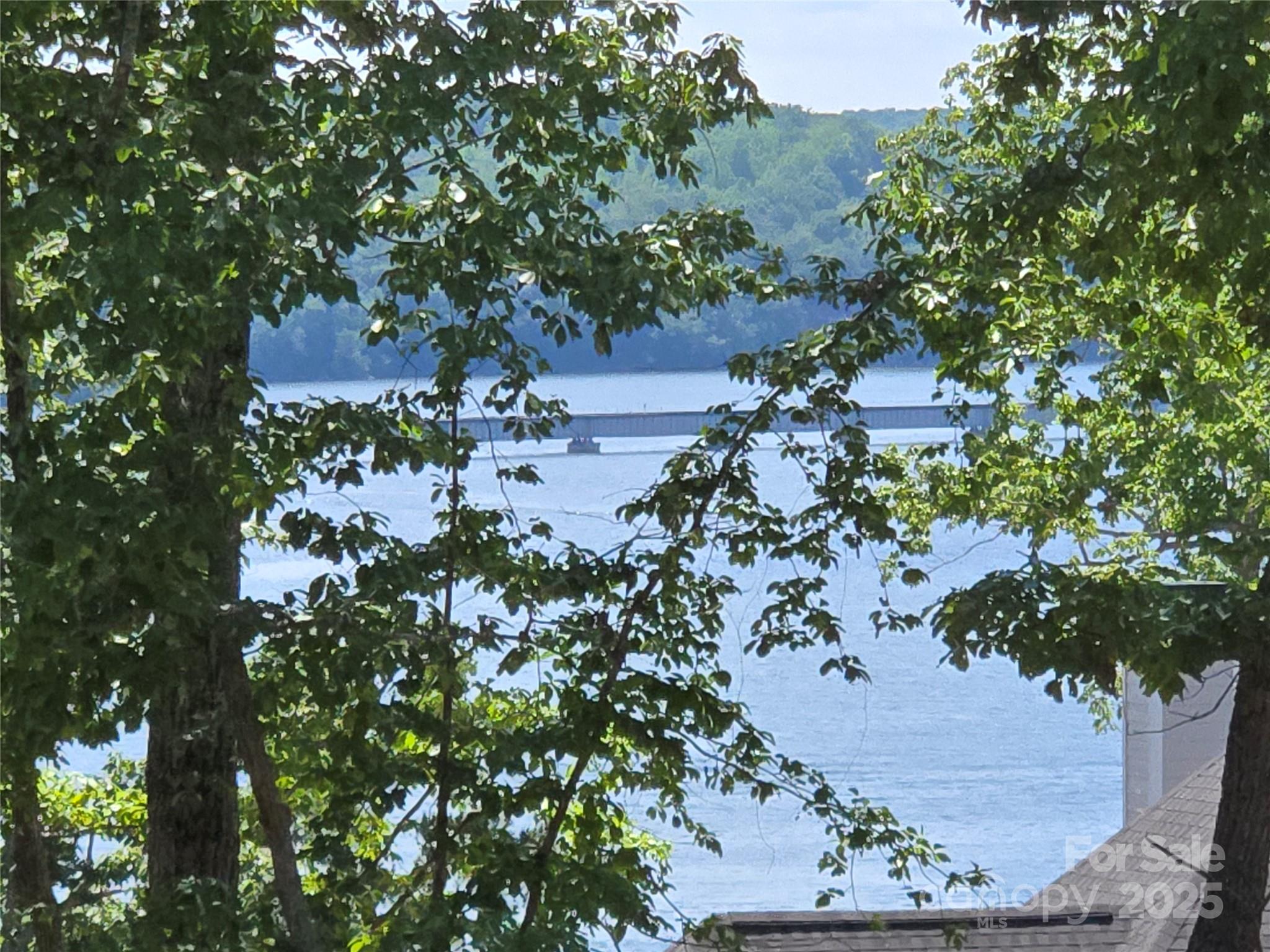 This premium Badin Lake water view lot is located in the prestigious gated community of Heron Bay. Great location with year-round views of the Main Channel. 1.2 acre lot. Come build your dream home or weekend get away on this ideal water view lot situated high above & overlooking the waterfront homes. Lot was previously permitted for a 3 bedroom home. The neighborhood includes a club house, community boat slips, paved boat ramp, walking trails & boat/RV storage. Heron Bay owners have the opportunity to join the adjacent Old North State Country Club. The Old North State Club offers a highly ranked golf course, marina, club house, restaurant, pool, tennis courts & more. Club opportunities require membership. Badin Lake has marinas that provide dining, gas & watercraft rental. The Uwharrie National Forest nearby is a great destination for camping, hiking, horseback riding & ATV/OHV trails. Within one hour from Charlotte, Greensboro & Winston-Salem. Look for the for sale sign by the road.