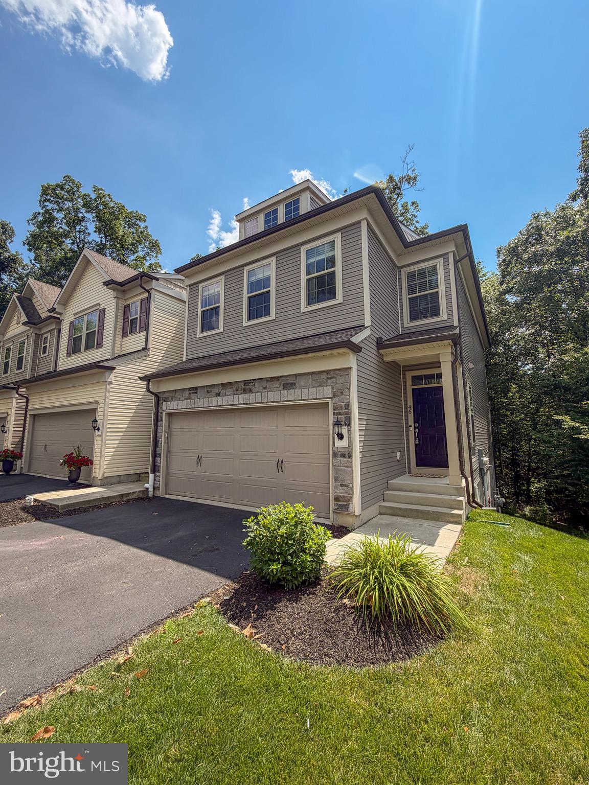 Live the lifestyle you've been waiting for. Perfectly positioned backing to the beautiful open woods of Applecross Country Club, this beautifully maintained end-unit townhome delivers true resort-style living with breathtaking views. Enjoy your morning coffee or evening sunsets from the deck, or step out from the walk-out lower level into your very own private forest, seamlessly blending indoor and outdoor living.The interior is light-filled, sophisticated, and move-in ready, showcasing hardwood floors throughout the main level, premium upgraded recessed lighting, and additional windows that add warmth and architectural interest throughout the living space.The oversized chef's kitchen is highlighted by a large center island with a built-in breakfast bar, stainless steel appliances, quartz countertops, and premium cabinetry. The expansive kitchen and adjacent living room feature a dynamic open-concept floor plan, making the home perfect for entertaining. A spacious two-car garage provides plenty of room for parking and storage.Upstairs, the primary suite offers a serene retreat with a beautiful walk-in shower, double vanity, and expansive walk-in closet. A second-floor laundry room adds everyday convenience without compromising the home's polished aesthetic. Two additional generously sized bedrooms complete the second floor.The walk-out  basement offers an exceptional opportunity to create additional luxury living space tailored to your vision, while already including a full bathroom.As a resident of Applecross, you'll enjoy a state-of-the-art fitness center, indoor and outdoor pools, a Caribbean-style pool bar, a Nicklaus-designed golf course, tennis courts, fitness and yoga classes, a full-service restaurant and bar, social events, family activities, basketball courts, and so much more.Applecross – Live Where You Play. This is more than a home—it's a lifestyle.