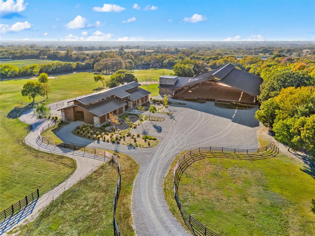 Premier Equestrian Living on nearly 50 acres of beautiful North Texas Land just minutes from Downtown McKinney. Offering exceptional facilities, thoughtful design and unmatched versatility.  This property combines Tract 23 which is 40.849 acres and Tract 333 which is 8.946 acres for a total of 49.795 acres. At the heart of the property sits an impressive 122x46 barn with removable stall walls allowing up to eight individual stalls or four oversized double stalls with individual exterior doors.  The barn features two wash bays, two tack bays, kitchen, tack room, bathroom, feed room and storage. Black Equine Paver Tile Flooring throughout the aisle way, safe and non-slip for horses. Access points include a large roll up door on the south side and double sliding doors at each end of the barn. Adjacent to the barn is an impressive 160x200 covered arena, ideal for year round training and events. Storage built in to the side walls of the arena. Observation area and lounge complete with full kitchen, dining area, living room. lounge, two dressing rooms and two bathrooms on the main level. A spiral staircase leads to a private loft bedroom and closet. Perfect retreat or guest accommodations. Scenic walking and riding trails throughout the property. Perimeter Fencing, Gated Entry, Stock Pond and Reservoir Frontage are just a few of the highlights.  With over 1000 feet of road frontage, there are endless opportunities for what this property can become.