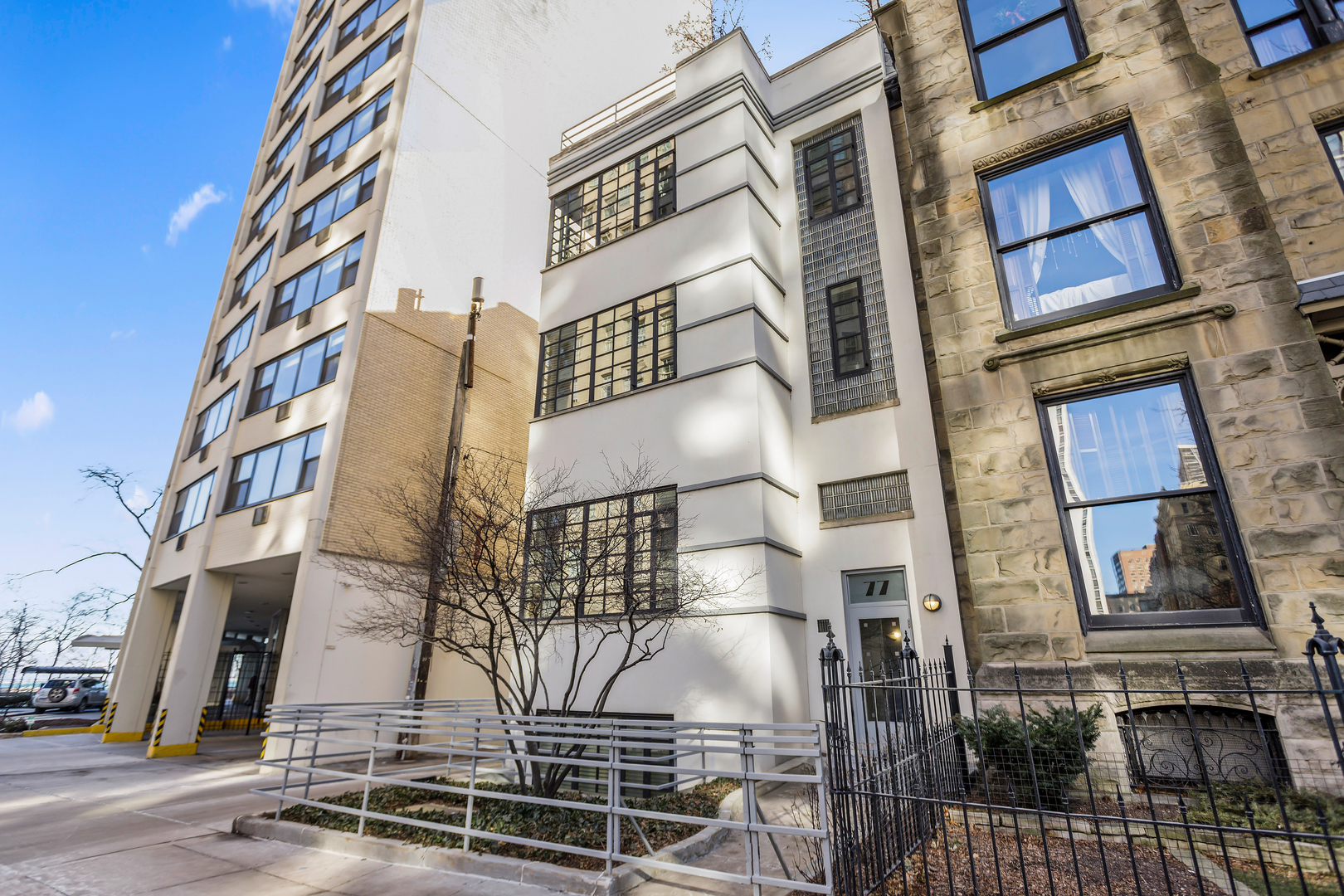 Experience the perfect blend of historic elegance and modern convenience in one of the city's most sought-after neighborhoods. This bright, Two-Story Penthouse on a peaceful stretch of Division Street is in the Heart of The Gold Coast. This duplex-up condo has 3-bedrooms and 3-bathrooms and offers a perfect blend of vintage charm and modern updates. Set in an intimate 2-unit building, this home features hardwood floors, beautiful original millwork and high ceilings, all complemented by a thoughtfully updated kitchen with breakfast bar, high-end appliances and custom cabinetry. The spacious layout includes a wide, sunlit living area with natural light streaming in through a wall of windows, capped off with a cozy gas fireplace. Plenty of space for multiple seating areas. The primary bedroom with ensuite bathroom, second bedroom, guest bathroom and tons of closets with in-unit W/D complete this level. A beautiful focal point, introducing classic vintage charm to this home, is a stunning wooden, carved staircase leading up to the penthouse level. Here the third bedroom with walk-in closet and ensuite bathroom, currently being used as a family room, leads to two outdoor spaces, including a magnificent rooftop oasis. Enjoy a 650sf deck complete with planters, plenty of seating, a gas line, lake and neighborhood views, ideal for al fresco dining, gardening, or simply unwinding in your own urban retreat. This unique home is just steps from the Magnificent Mile, Lake Michigan's Oak Street beach, shopping, restaurants and transportation. This home offers access to Chicago's finest amenities while maintaining a peaceful residential feel. Welcome home to timeless Gold Coast living. Contact Listing Agent for parking information.