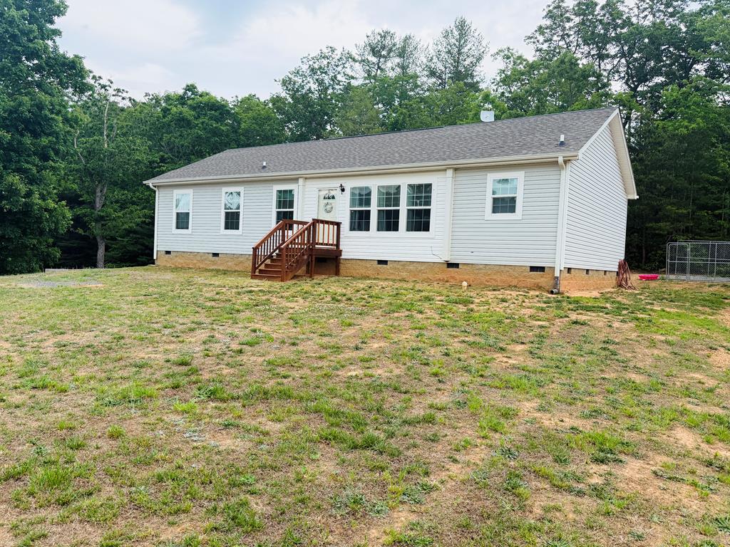 Beautiful like-new home located in the desirable Cana area of Carroll County! This well-maintained 3 bedroom, 2 bathroom home offers approximately 1,485 finished square feet with an inviting open floor plan and modern finishes throughout. Built in 2021, this property has been exceptionally cared for and feels almost brand new.  The home features spacious bedrooms, a comfortable living area, and a well-equipped kitchen perfect for everyday living or entertaining. Some furnishings are negotiable, offering a move-in ready opportunity for the next owner. Outside you will find a nice outbuilding providing excellent storage or workshop space, along with a privacy fence. Conveniently located with paved road frontage and public water, this property combines peaceful country living with modern convenience. Whether you are looking for a full-time residence, retirement home, or investment opportunity, this beautiful property is one you do not want to miss! Approximately one mile to I-77, 10 minutes to Mt Airy NC, and 15 minutes to the Blue Ridge Parkway.