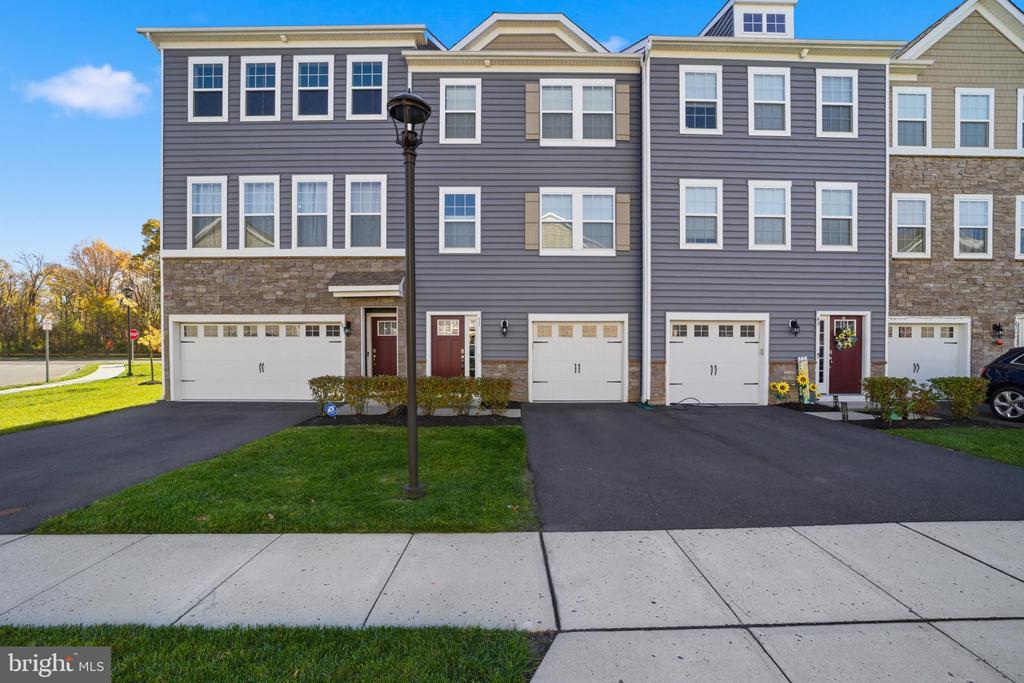 Only a few years old, this stunning 3-story townhome blends modern design, low-maintenance living, and comfort in one of Mount Laurel’s most desirable new communities.  51 Turin Way offers a transitional layout with a craftsman-style look. 3 beds, 2/1 baths, 1 car garage, 2,254 sq ft, deck overlooking the pond (highly sought after lots when it was being built)Entry Level:Spacious flex room currently used as a Family Room with sliding glass doors open to the backyard and the common area. Utilities are located in the closet under the stairs. The garage access is right off the front hallway. Recessed lighting throughout.Main Level:Open-concept layout ideal for entertaining or everyday livingChef’s Kitchen featuring: Designer cabinetry, Quartz countertops, Full stainless-steel appliance package, kitchen island with three stool seating for casual dining.Luxury vinyl plank flooring throughoutSliding glass doors lead to the large deck with a pond viewConvenient Powder Room on this levelLiving Room with high ceilings. Recessed lighting throughoutUpper Level:Primary Suite with luxurious private bath, dual sink vanity, stall shower with subway tile surround. Walk-in closet with attic access.Two additional spacious bedroomsAnother full bathroom for guests or familyThe washer and dryer are conveniently located on this floor.Location Perks:Minutes from Routes 38 & 295 for easy commutingClose to shopping, restaurants, Philadelphia, and the shoreQuiet, scenic community with walking paths and green spaceMove right in and start enjoying the Signature Place lifestyle — modern, peaceful, and perfectly located!