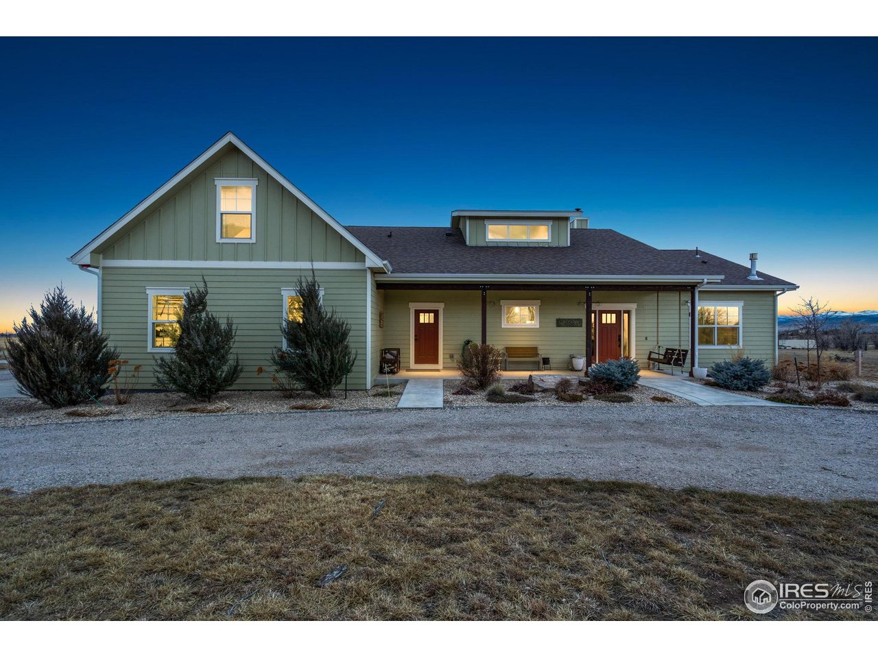 Welcome to 939 W County Road 74 in Wellington - a semi-custom home situated on 3.36 acres with expansive mountain views and a peaceful rural setting, conveniently located approximately 15 minutes from Wellington and about 20 minutes from downtown Fort Collins. The covered front porch provides a welcoming entrance into a home filled with natural light and thoughtful design. The main level features a wide-open floor plan with soaring ceilings throughout the kitchen, dining area, and family room, creating a bright and spacious atmosphere. The kitchen is well-appointed with a large island, stainless steel appliances, and a gas range, offering generous space for meal preparation and gathering. The dining area flows seamlessly from the kitchen, and the family room centers around a beautiful wood burning fireplace. A barn door off the kitchen leads to a combined mudroom and laundry room, which also offers a separate entrance from the covered front porch for added convenience. The primary bedroom is located on the main level and includes sliding glass doors that open to the covered back patio. The en-suite bathroom features a soaking tub, a large walk-in shower with built-in seating, and a spacious walk-in closet. Two additional bedrooms and a full bathroom complete the main floor. Upstairs, two additional bedrooms are connected by a Jack-and-Jill bathroom, providing flexible living arrangements. The backyard includes a large patio, partially covered, with an amazing built-in kitchen and gas fire pit. The outdoor spaces are positioned to take advantage of the surrounding mountain views and open landscape. An oversized three-car garage offers ample room for vehicles and storage. This home combines modern features, open space, and convenient access to nearby amenities in a desirable Northern Colorado location.