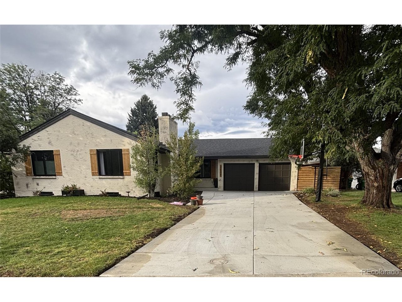Thoughtfully updated and extensively maintained, this move-in-ready Holly Hills ranch offers comfortable main-level living, a spacious finished basement and a 0.26-acre lot. Major improvements since 2019 include a full sewer-line replacement, Class 4 roof, high-efficiency HVAC with air purification, Renewal by Andersen windows, updated electrical service, water heater, gutters and drainage. All three bathrooms have been remodeled, including a zero-threshold main-level shower. Additional updates include fresh paint, modernized doors and hardware, updated lighting, kitchen appliances, basement carpet and flooring. Exterior highlights include a custom limewash finish, new concrete driveway and walkway, cedar-and-steel privacy fence, water-efficient irrigation and an attached two-car garage with a professionally coated floor. Located on a quiet, tree-lined street in the Cherry Creek School District with convenient access to the High Line Canal and Denver-area amenities.