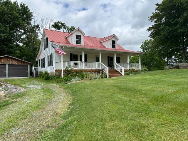 Beautiful Views in Elk Creek VA! This charming 2/3 bedroom, 2 bath home in the Comers Rock community features picturesque views of this charming farming community. The home has a nice, open floorplan, walk in closets, covered front and back porches and an open side deck, The yard is beautiful with mature trees and large rock outcroppings, there is even some frontage on a creek behind the house. A detached, two car garage is easily converted to a workshop that is upgraded with electric and a propane heater. An additional outbuilding is also located on the property. If you need to work from home, do not worry, this home has a highspeed fiber connection. Perfect for a primary residence, weekend getaway or vacation rental, this property is located in very close proximity to Jefferson National Forest, hiking and equestrian trails and not far from the New River and Grayson Highlands Park.