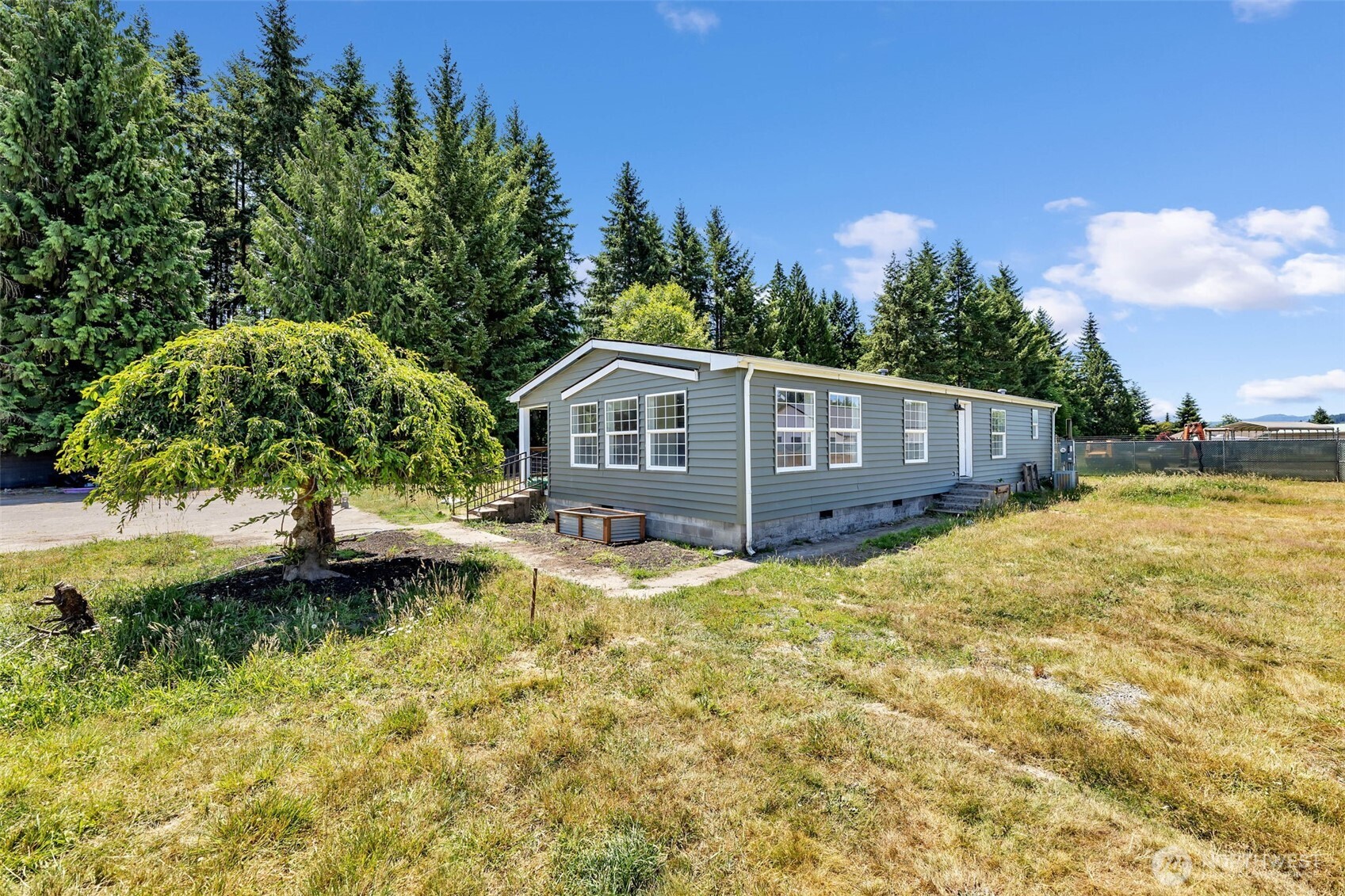 MUST SEE - NEW REDUCED PRICE!!! Make yourself at home in this 1,512 sq ft double-wide manufactured home in Toledo, WA, set on a vast, usable 5 acre flat lot. Relish a breathtaking view of Mt. Rainier from your doorstep and enjoy modern enhancements, including a newer roof, fresh siding, and updated flooring. With 3 bedrooms, 2 bathrooms, and convenient freeway proximity, this well-maintained property balances tranquility and accessibility. Space for an RV or Trailer AND with hookups! Ideal for those seeking a slice of countryside living.