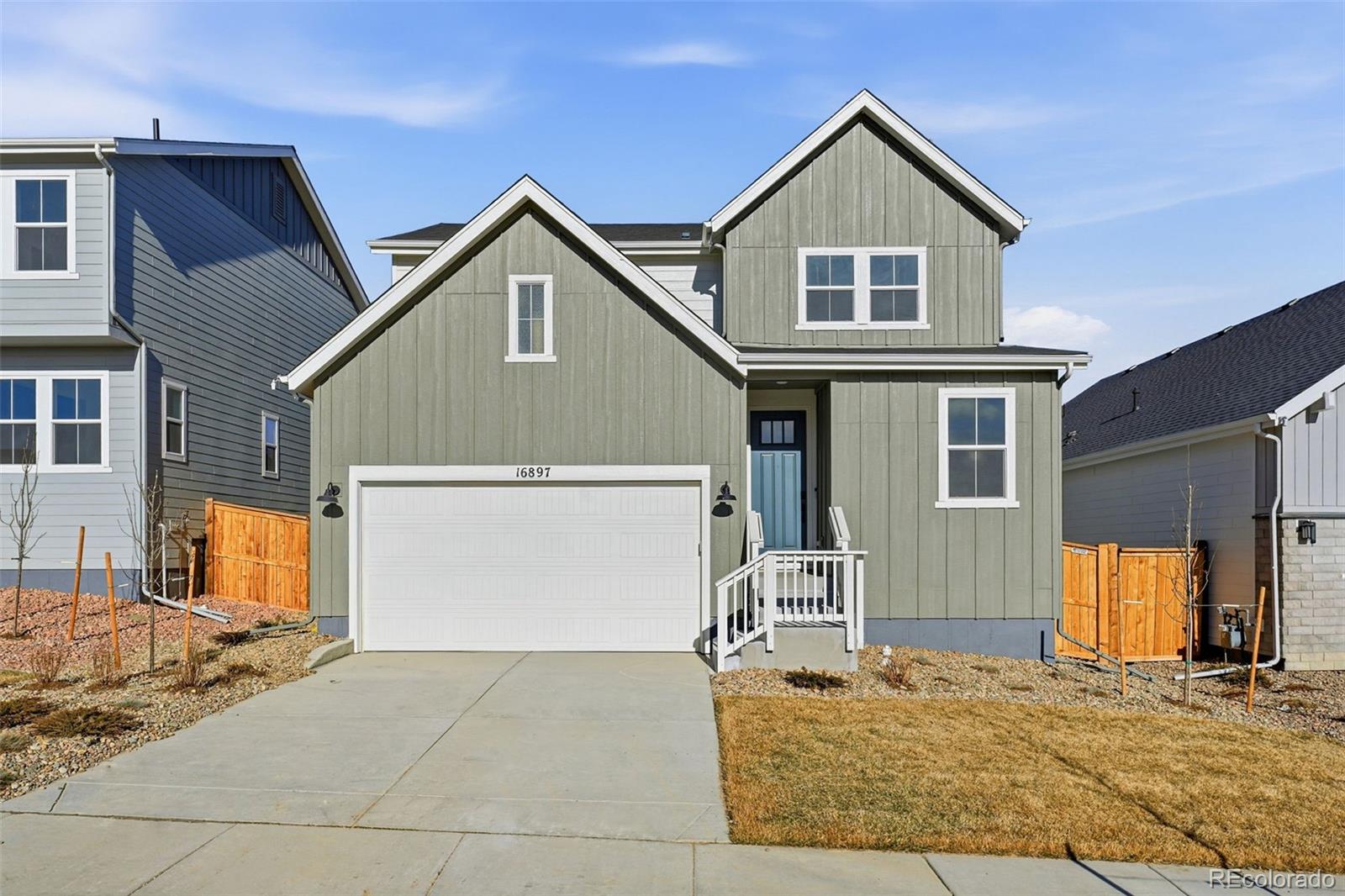 What's Special: No Rear Neighbors | Covered Patio | South Facing. New Construction – Ready Now! Built by America's Most Trusted Homebuilder. Welcome to the Estes at 16897 W 92nd Drive in Trailstone Town Collection! Set in a new Arvada community near the Rocky Mountains, this neighborhood offers stunning views, spacious homes, and future amenities like a pool and pickleball courts—all just 15 miles from Boulder. This new home features a main-floor bedroom and full bath, an open kitchen with island and pantry, and a bright great room that leads to a covered patio. Upstairs includes a spacious primary suite, loft, two secondary bedrooms, full bath, and laundry room. Modern living meets mountain charm—welcome to Trailstone. Additional Highlights Include: Downstairs bedroom in place of flex, full bathroom in place of powder room, sliding glass door at great room, covered patio, and second sink at upstairs secondary bath. MLS#3874891