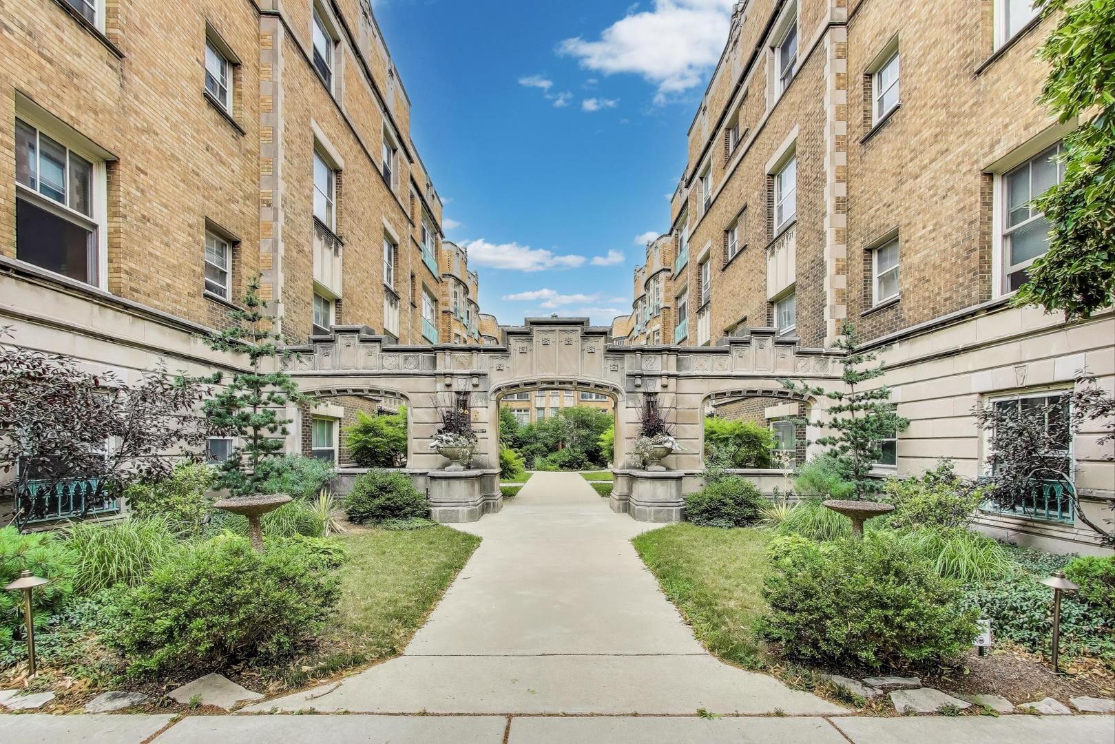 Designed by renowned architect Paul Frederick Olsen, this elegant 1924 condo is perfectly positioned at the eastern edge of the Midway Plaisance, just steps from the future Obama Presidential Center. The surrounding area is undergoing a $4 million revitalization, including a universally accessible playground, restored historic landscaping, improved drainage, and refurbishment of the Cheney-Goode Memorial. Tucked away in a serene, landscaped courtyard, this generously sized apartment spans nearly 1,000 square feet and the full width of the building. It offers tranquil views of two picturesque gardens and a rare combination of vintage character and thoughtful updates. The separate living room opens to a charming Juliet balcony, while the spacious dining room-ideal as an office or family room-adds flexibility to the layout. Classic details like hardwood floors, picture-frame molding, and a vintage tiled bathroom add timeless appeal. Comfort is ensured year-round with mini-split air conditioning. Additional features include a private washer and dryer for the owner's exclusive use, secure bike storage, and a dedicated storage locker-all located in the basement of the building tier. A heated garage space in the neighboring Vista Homes garage is included and may also be rented. Unbeatable location just steps from the University of Chicago campus, Metra train, and CTA #6 and #15 bus routes. Monthly assessments cover heat, gas, Everywhere Wireless internet, and property taxes. Smoke-free building.