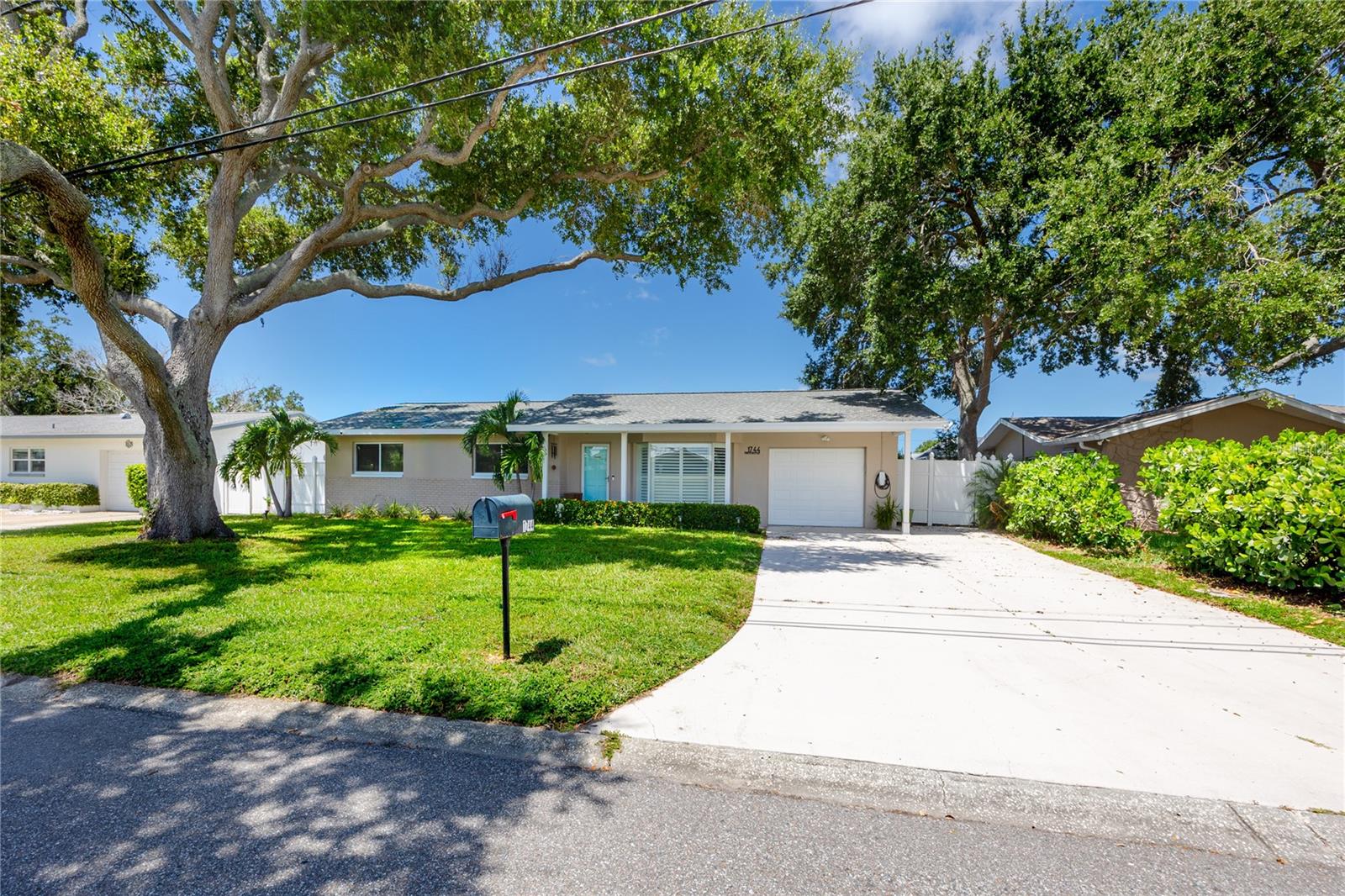 Virtually Staged. Privacy and space define this beautifully updated 3BR/2BA home in Harbor Hills... on a non- thru street. At 1,783 square feet with an oversized one-car garage + backyard Shed, this move-in-ready property offers a flowing floor plan filled with natural light throughout, with tile flooring throughout the entire home.  ** 5 miles to Indian Rocks Beach ** The formal living room features crown molding and a grand bay window, while the efficient kitchen with tray ceiling opens easily to the family room. The dining area also connects to the family room and extends into a separate sun/exercise/bonus room, where walls of windows overlook the PRIVATE, OVERSIZED, FENCED BACKYARD  (80' x 20') — ideal for a POOL, entertaining, gardening, or simply enjoying Florida living. ** Recent updates include: fresh interior paint and trim, newer lighting fixtures and nickel hardware, updated landscaping, white vinyl windows with hurricane protection film, hurricane shutters, Tesla Super Charger, Plantation shutters, newer garage door, updated electrical (2021), tile roof (2020), and hot water heater (2024). ** This home is a fantastic fit for downsizers, first-time buyers, or anyone seeking a second-home retreat. Harbor Hills is a deed-restricted community close to shopping, dining, medical services, and Florida's white sand beaches. Well maintained and ready for its next owner — schedule your showing today. ** Home is CLOSE TO THE BEACH and ideal for salt-life living! Security System included. Washer and Dryer can convey with the home.